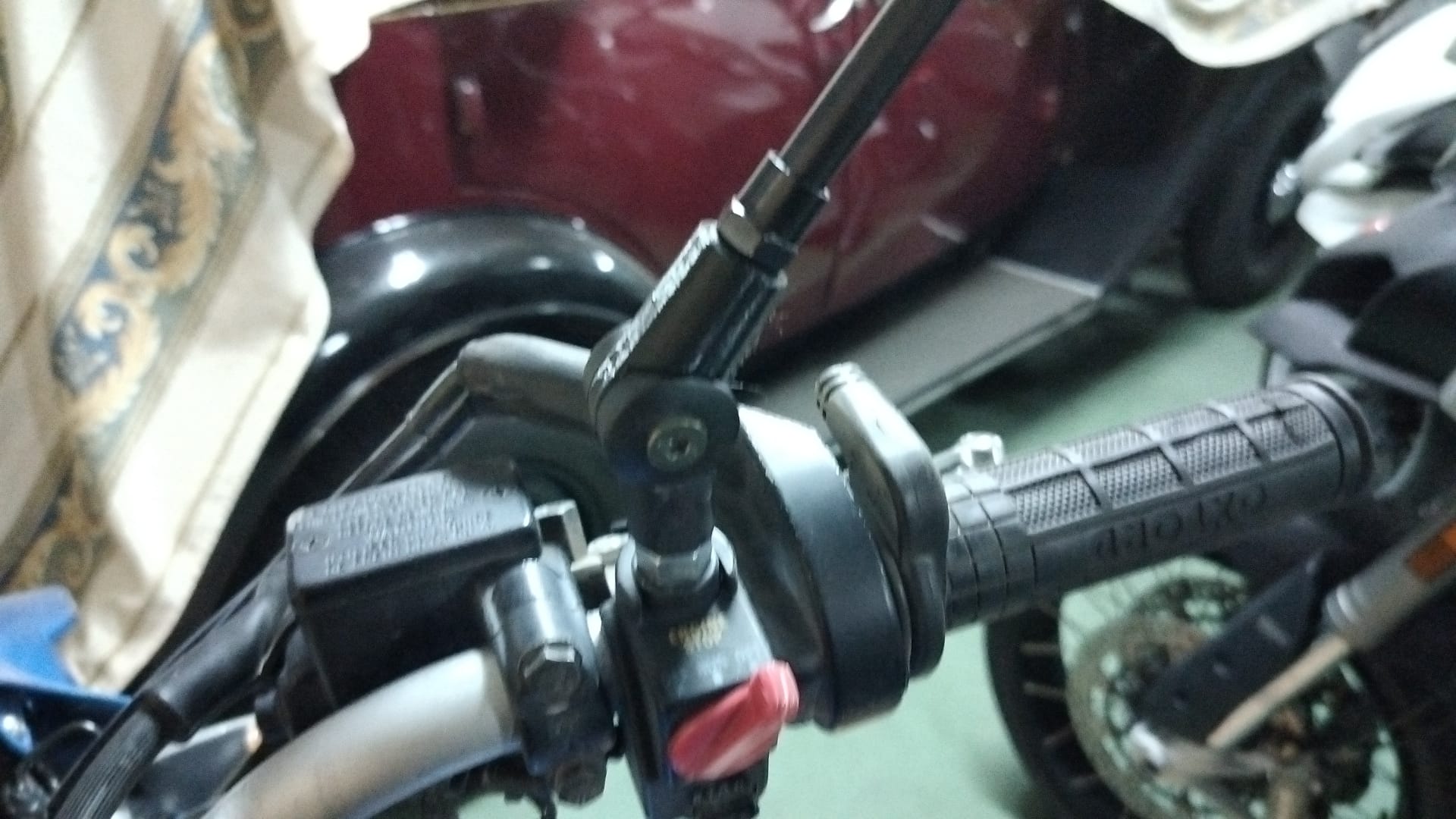 Foldable mirror pivot arm.