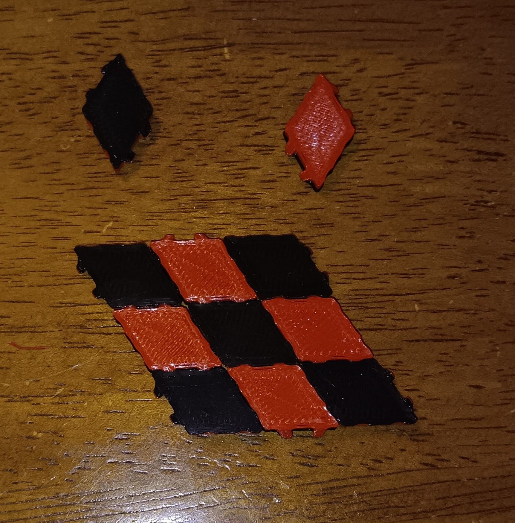 Two-sided rhombus tiles with hidden tabs
