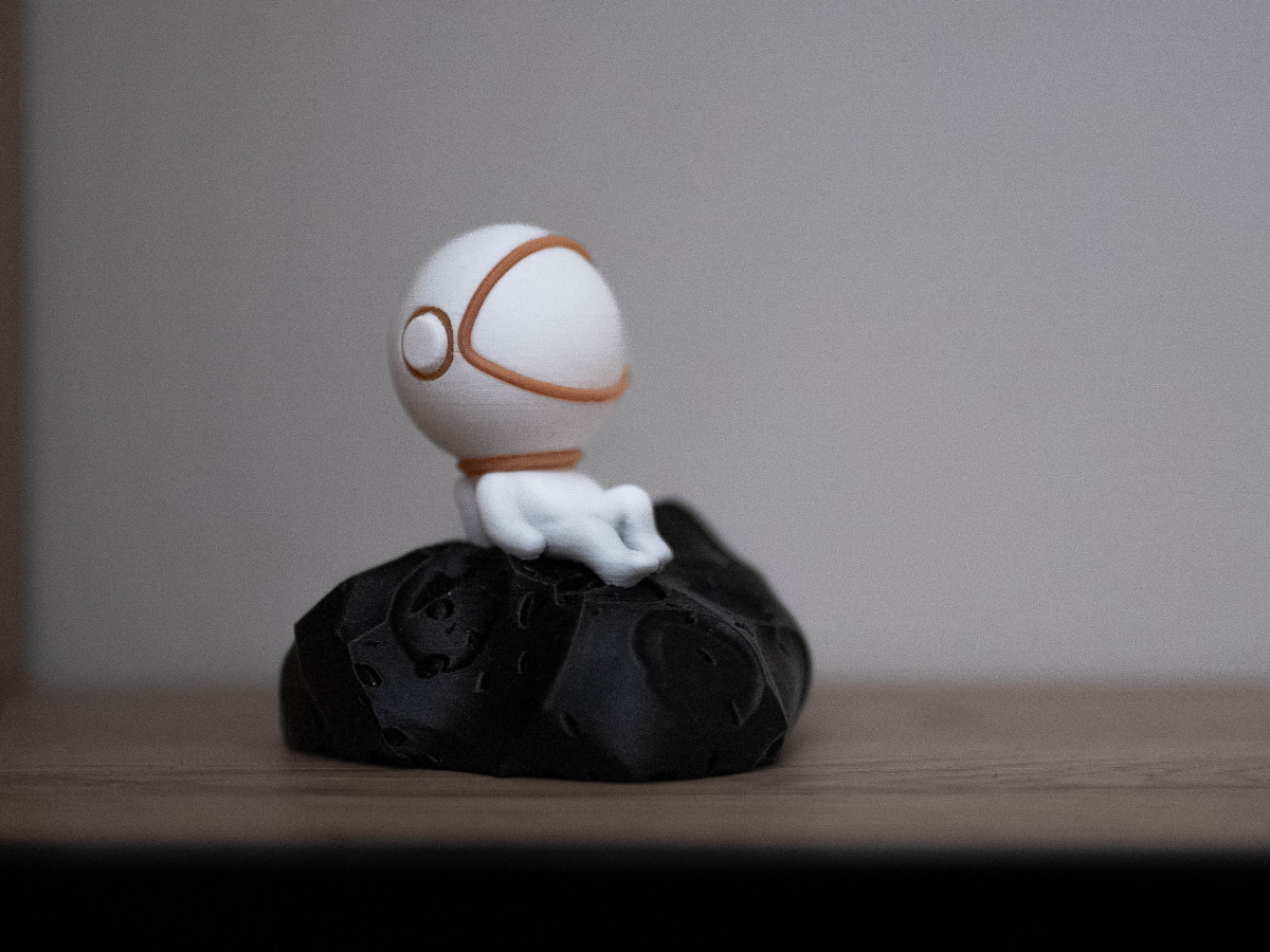 Adorable Astronaut Chilling on His Asteroid