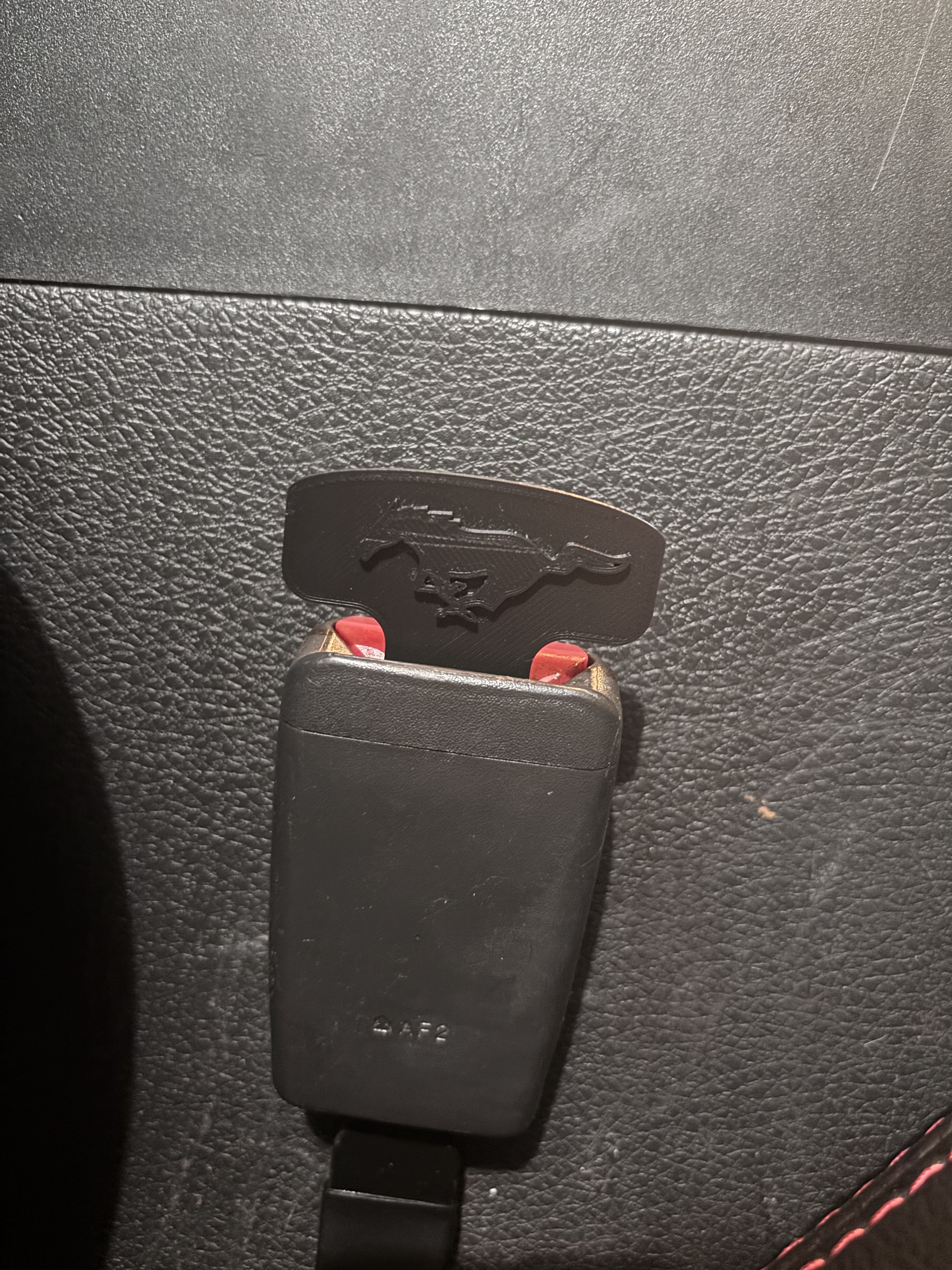 Seatbelt silencer with Mustang pony symbol