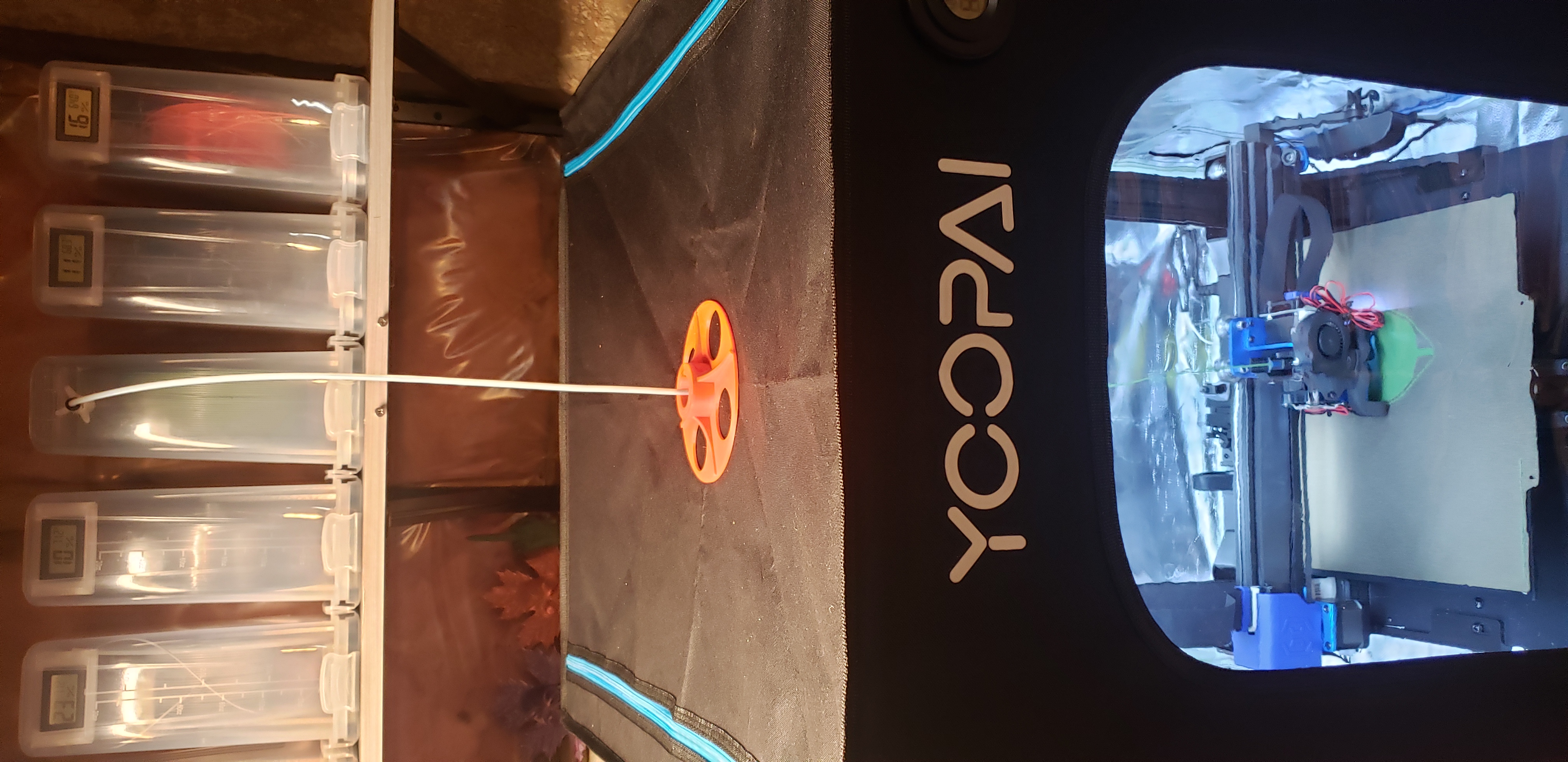Swiveling enclosure filament PTFE feed through - print in place
