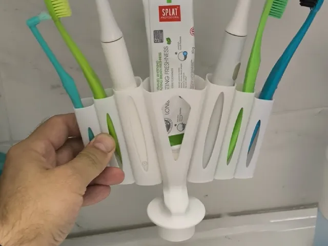 Plug on the sink. Organizer for toothbrushes.