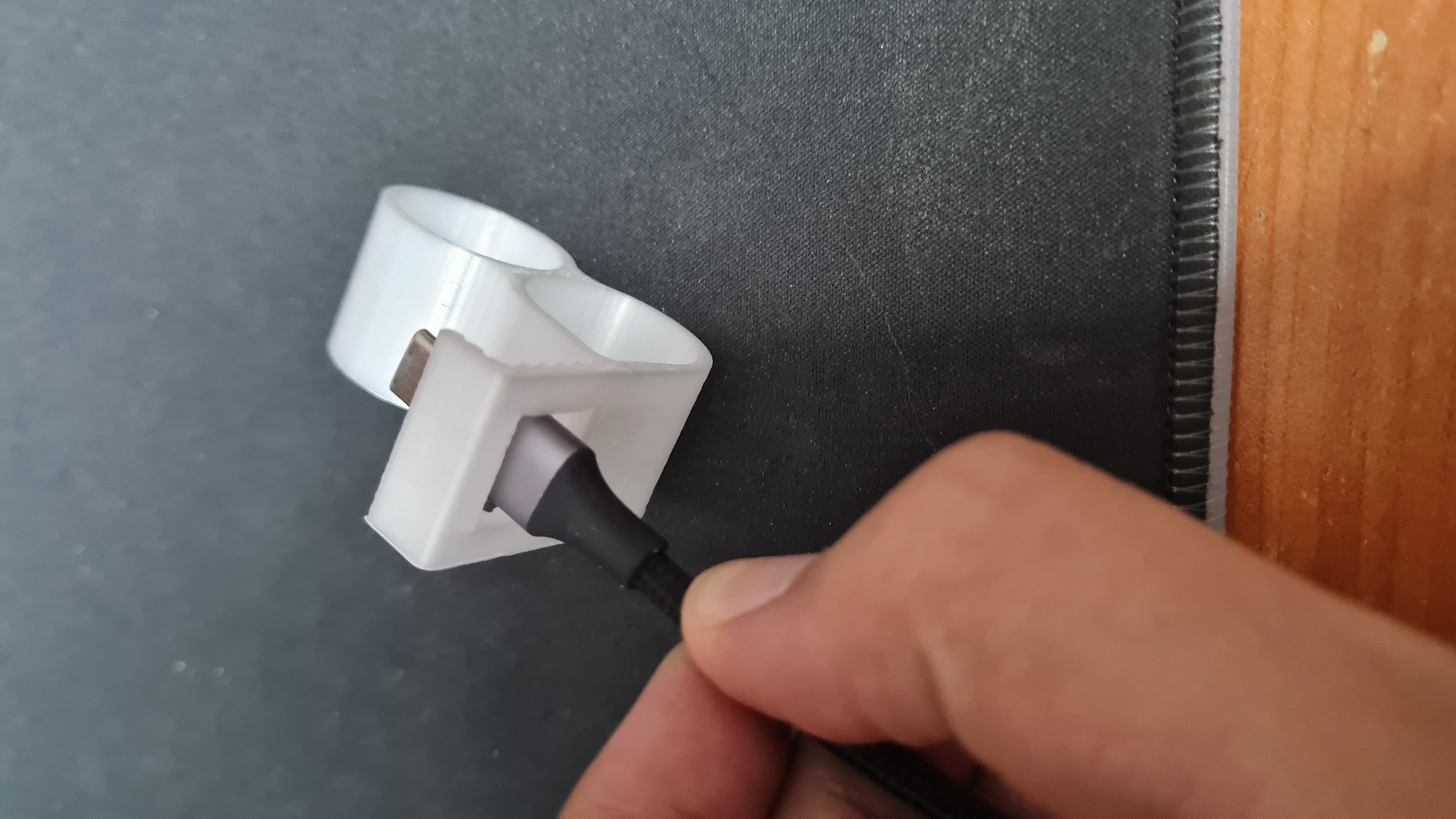 Finger phone support hook with cable hole