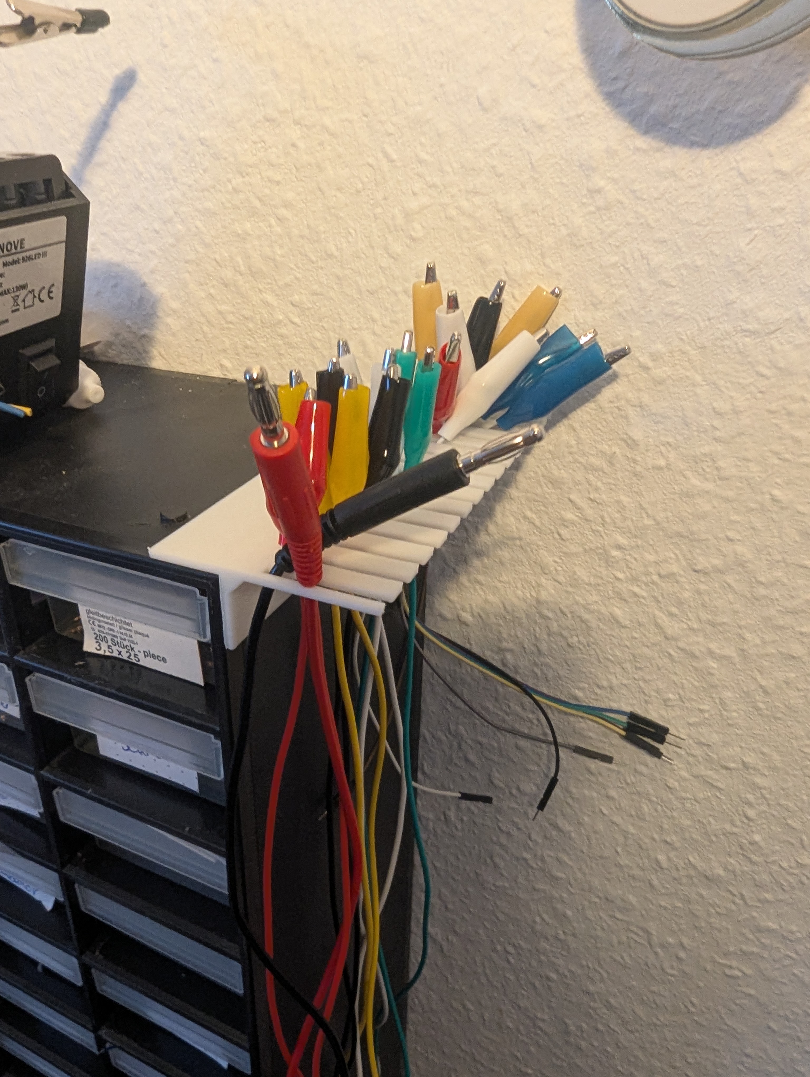 Cable-holder for small parts box