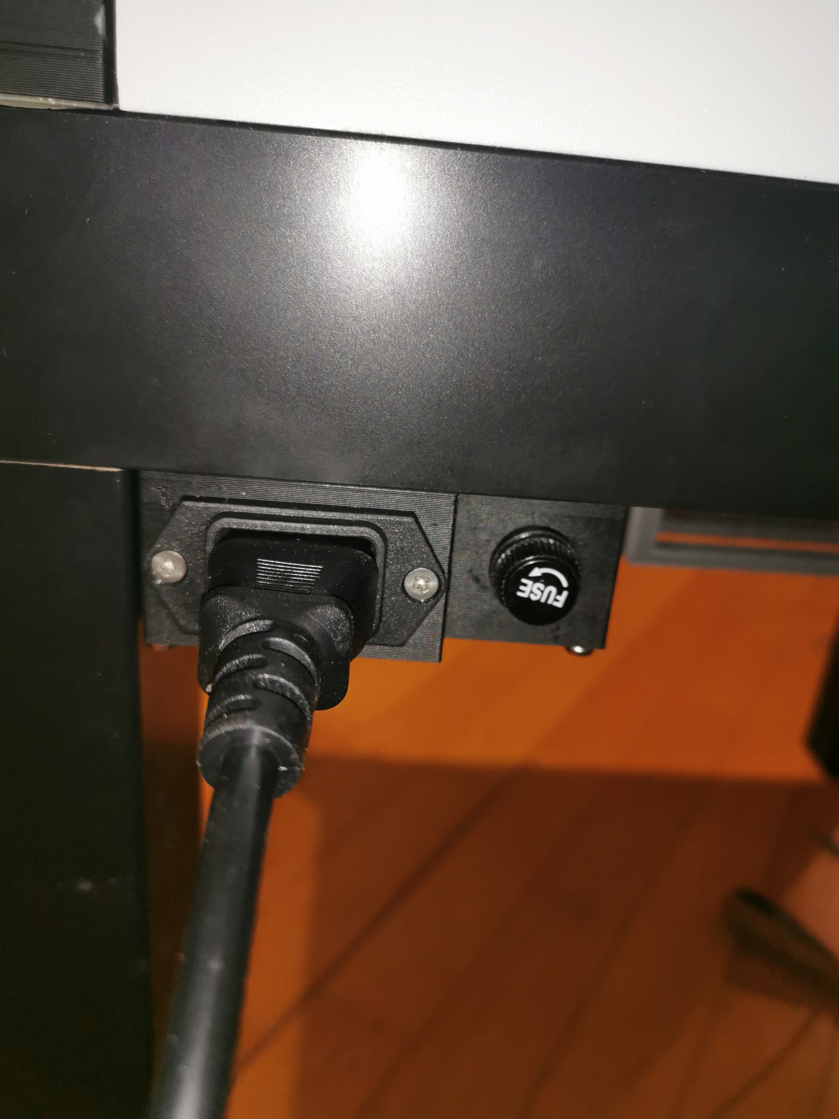 Printer enclosure power socket with fuse