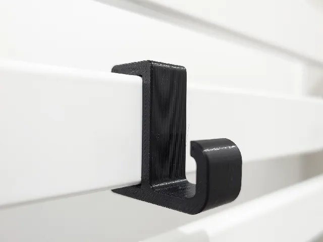 Towel hook for a bathroom radiator