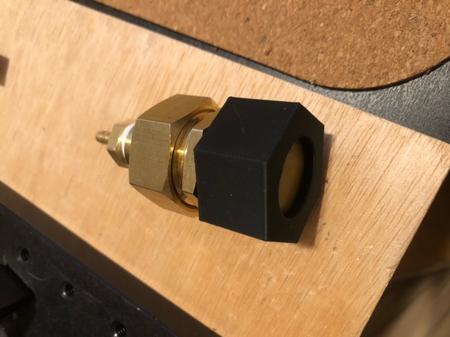 hose cap with a concentric 20mm diameter hole.