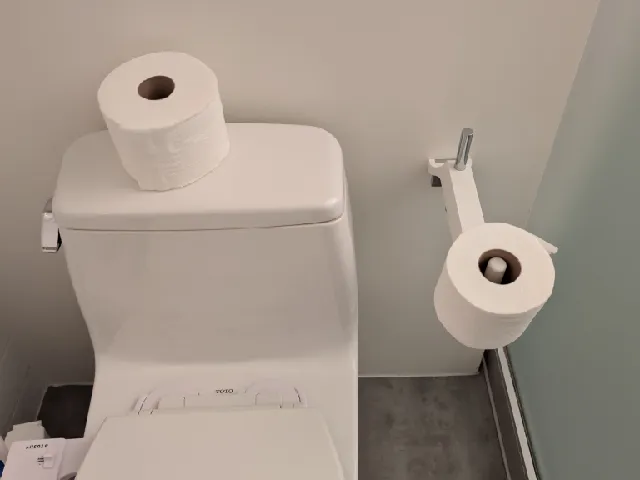 Toilet paper holder extension
