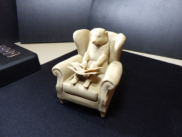 Otter in a Chair Reading.
