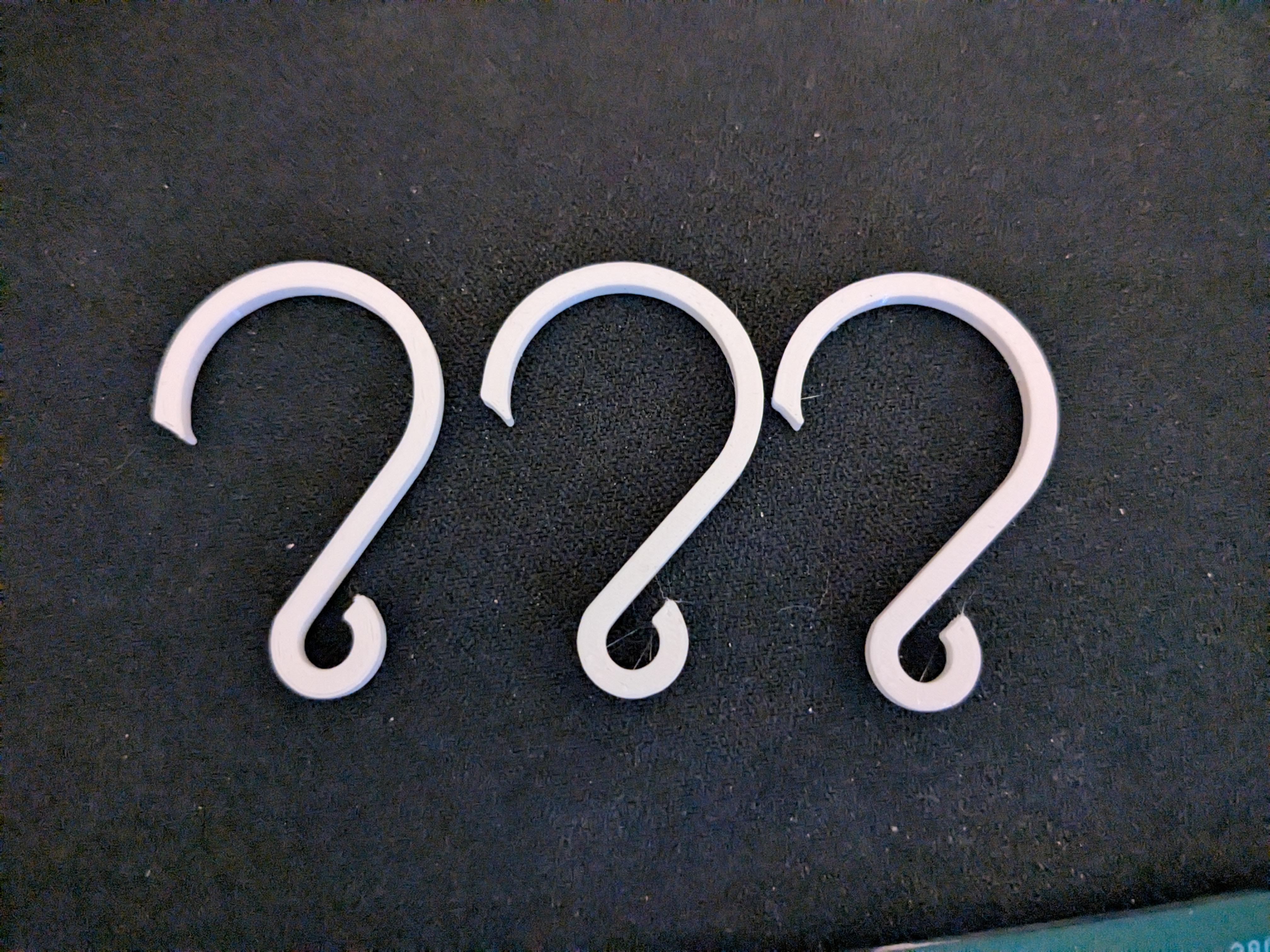 Trinket hanger for a round pipe