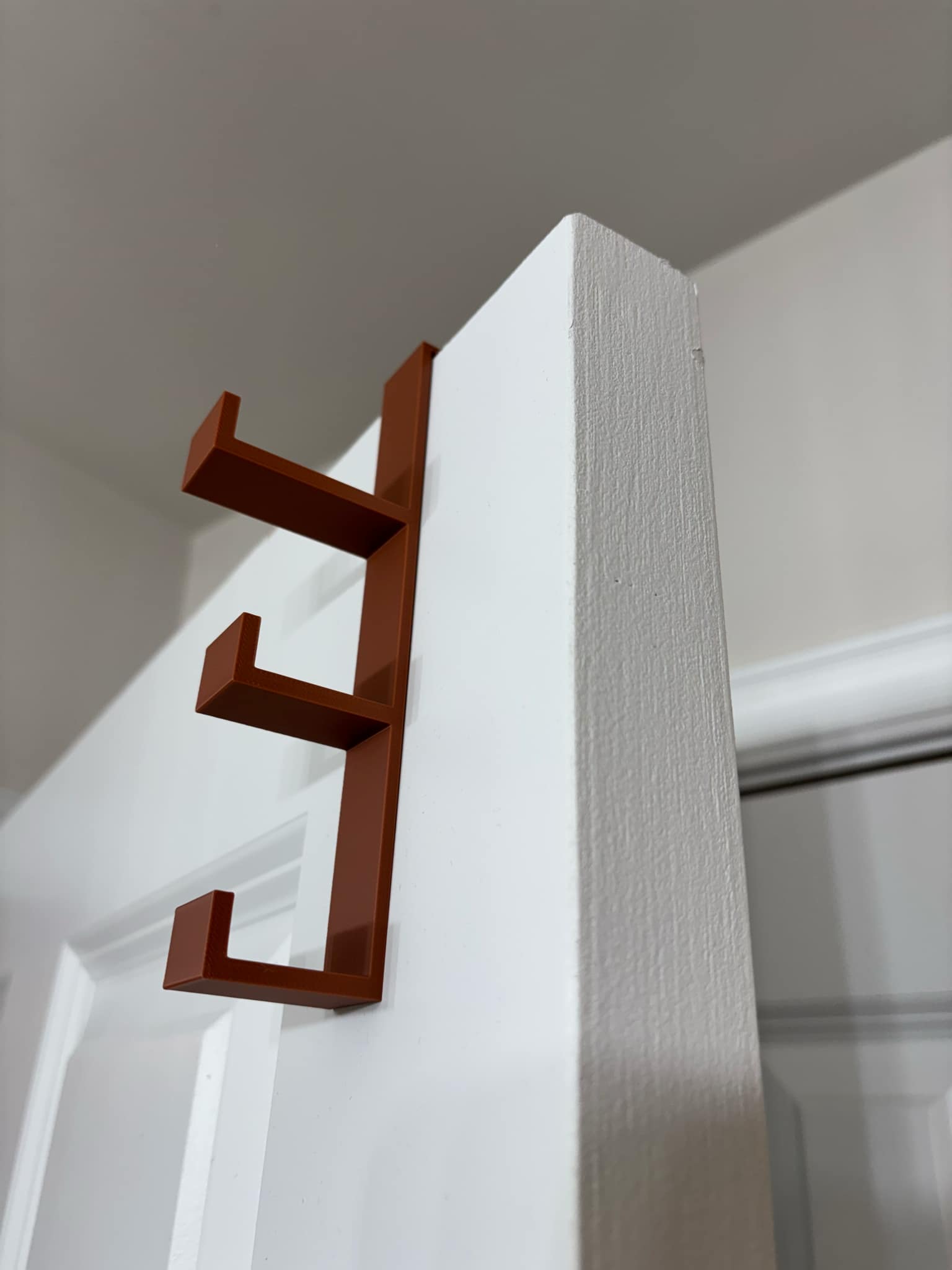 Three hook over the door hanger hook