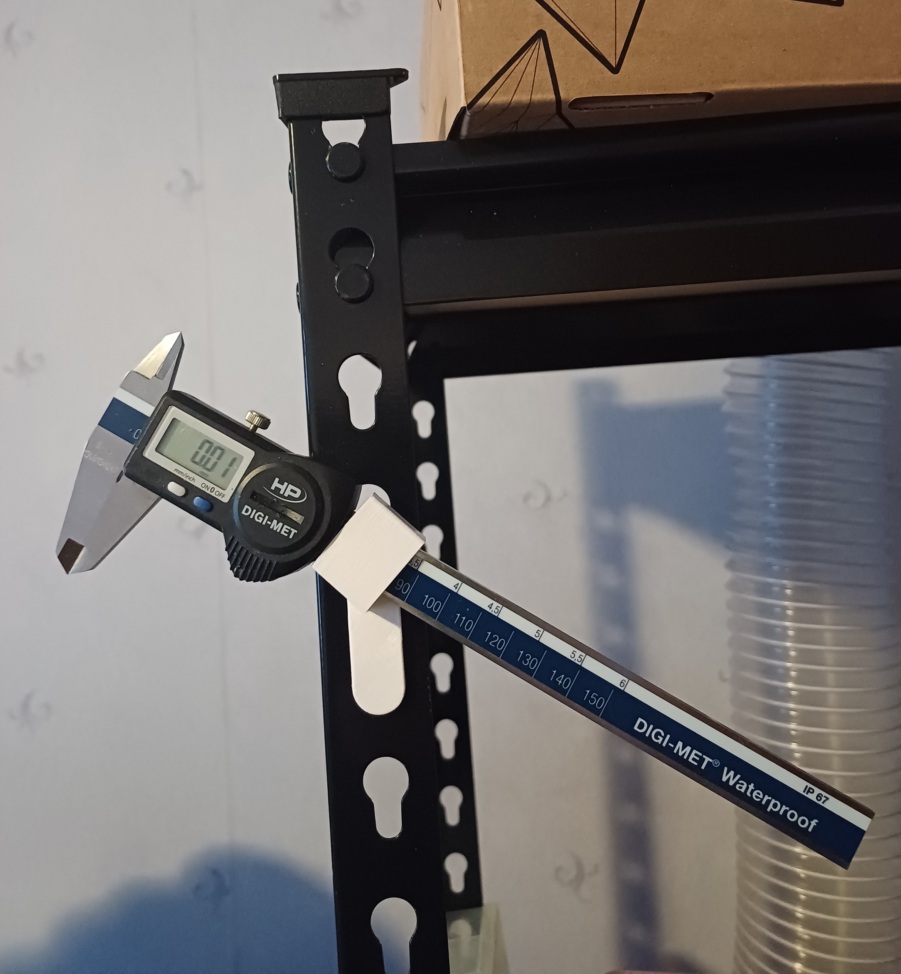 Caliber holder for storage shelf.