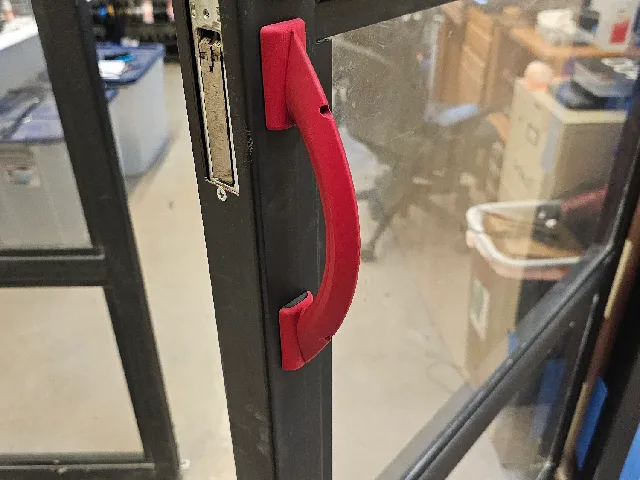 Command strip mounted bay door handle