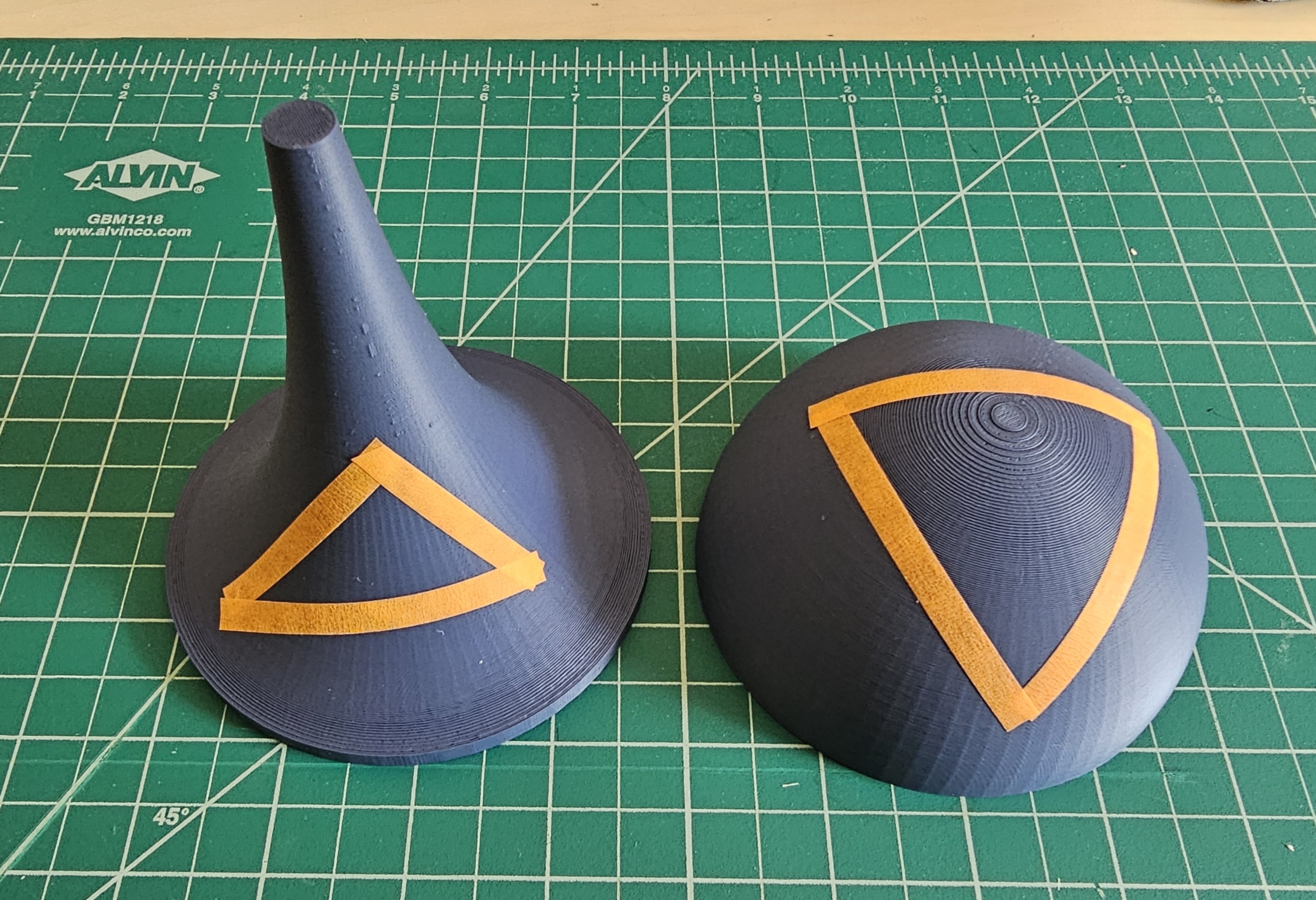 Pseudosphere and half-sphere - surfaces with negative and positive Gaussian curvature