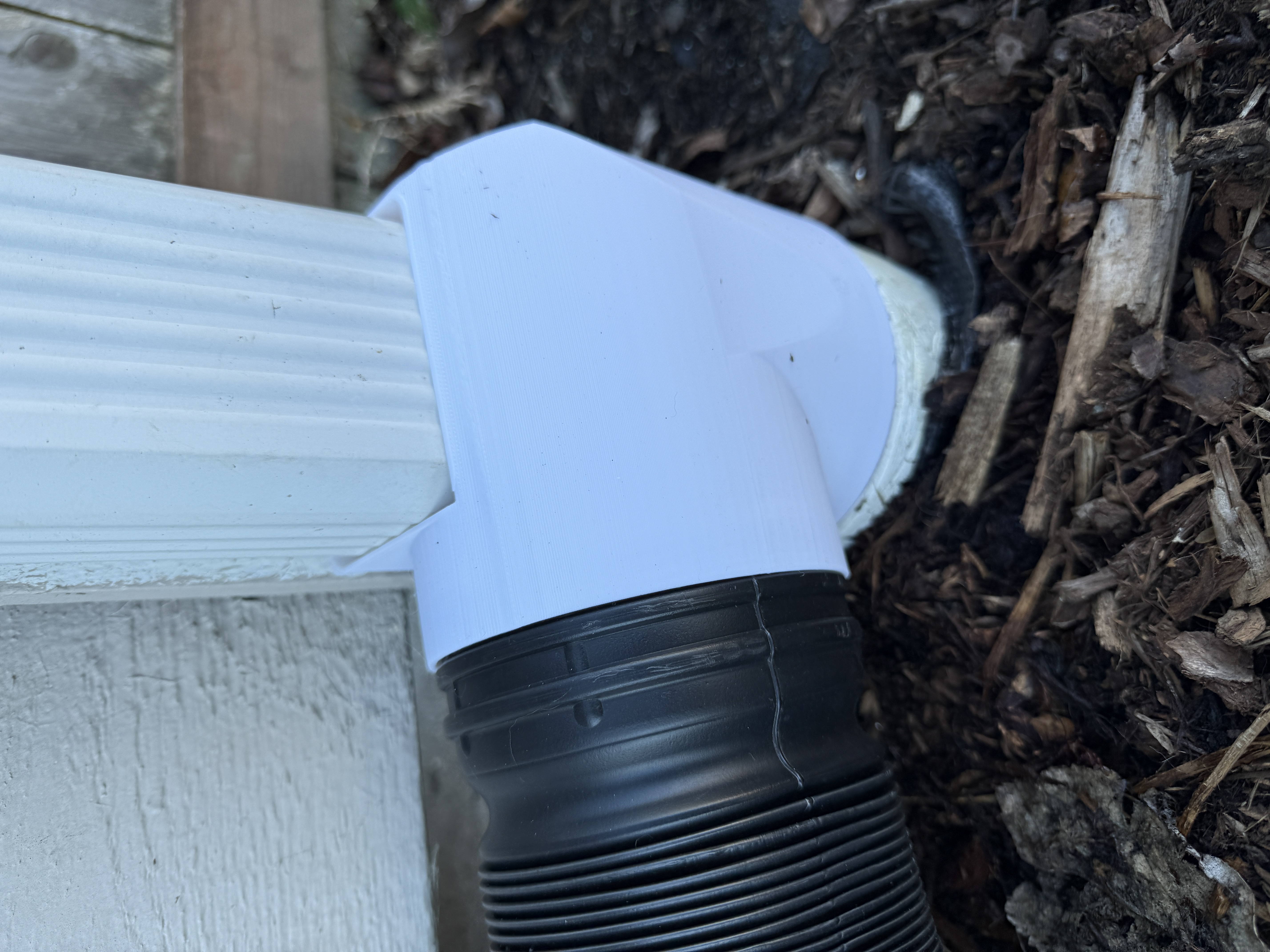 3"x2" downspout to 4" flex drain to 4" PVC drain
