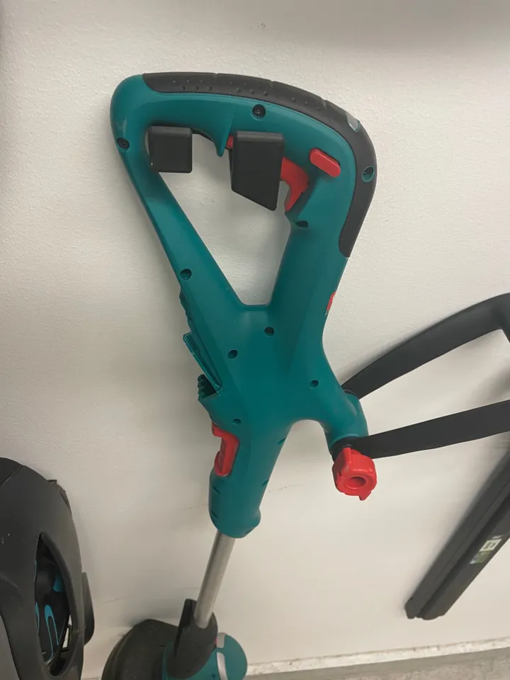 Bosch trimmer wall mount by Jesper B Download free STL model