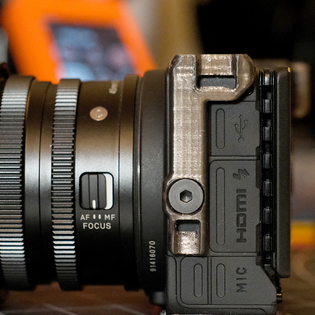Sigma fp compact left side strap connector