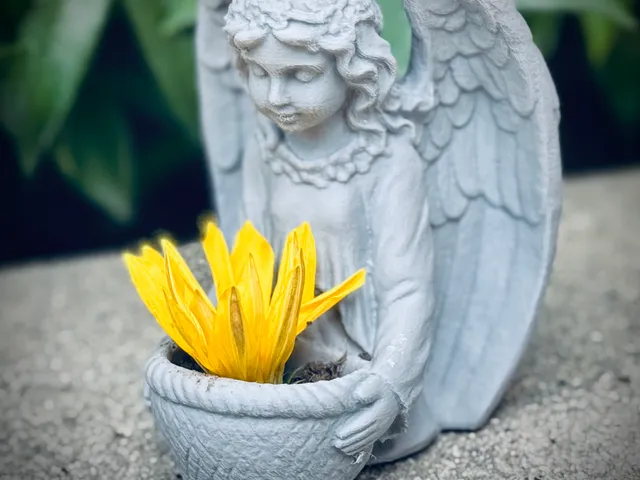 Angel Holding A Basket