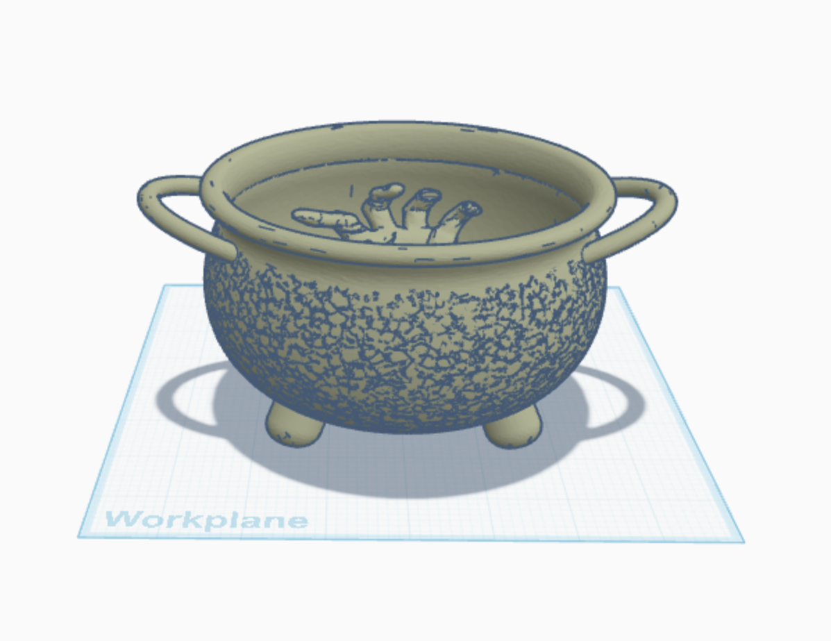 Halloween cauldron with a zombie hand.