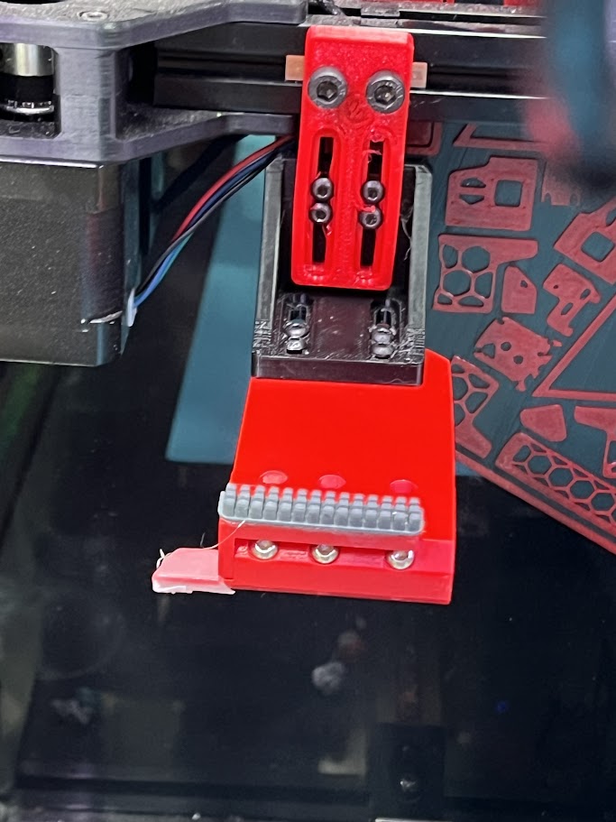 Gantry mounted nozzle scrubber with auto poop-eject
