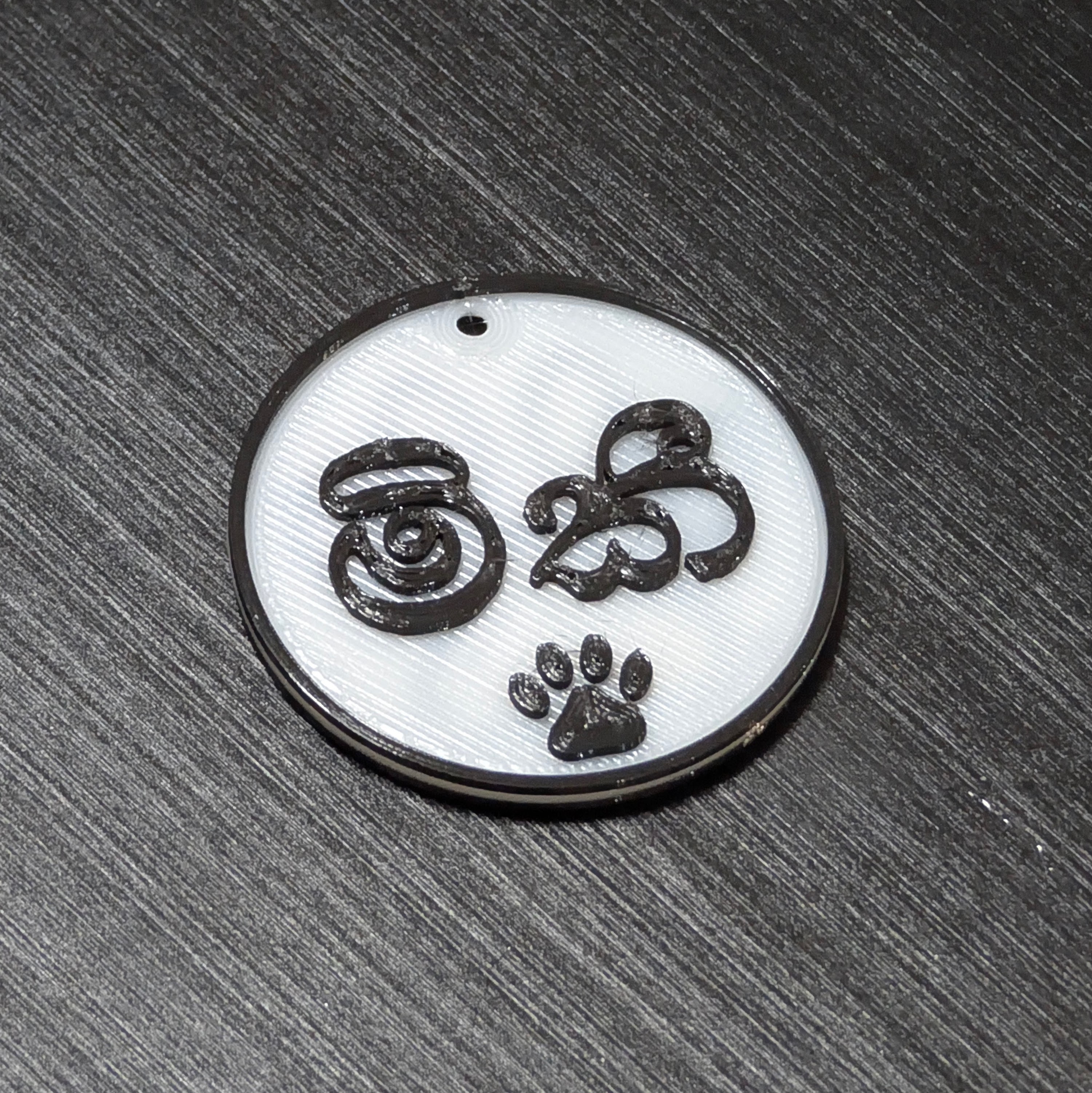 Cat collar tag Mickey, in Sinhala script