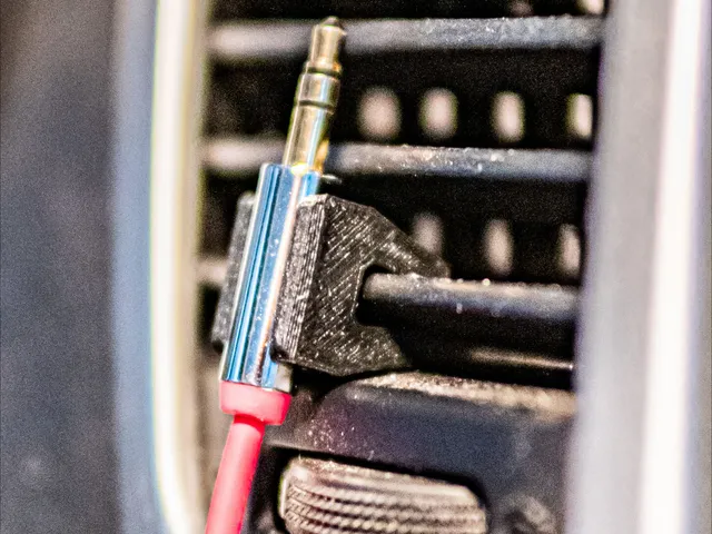 Car air vent headphone cord holder