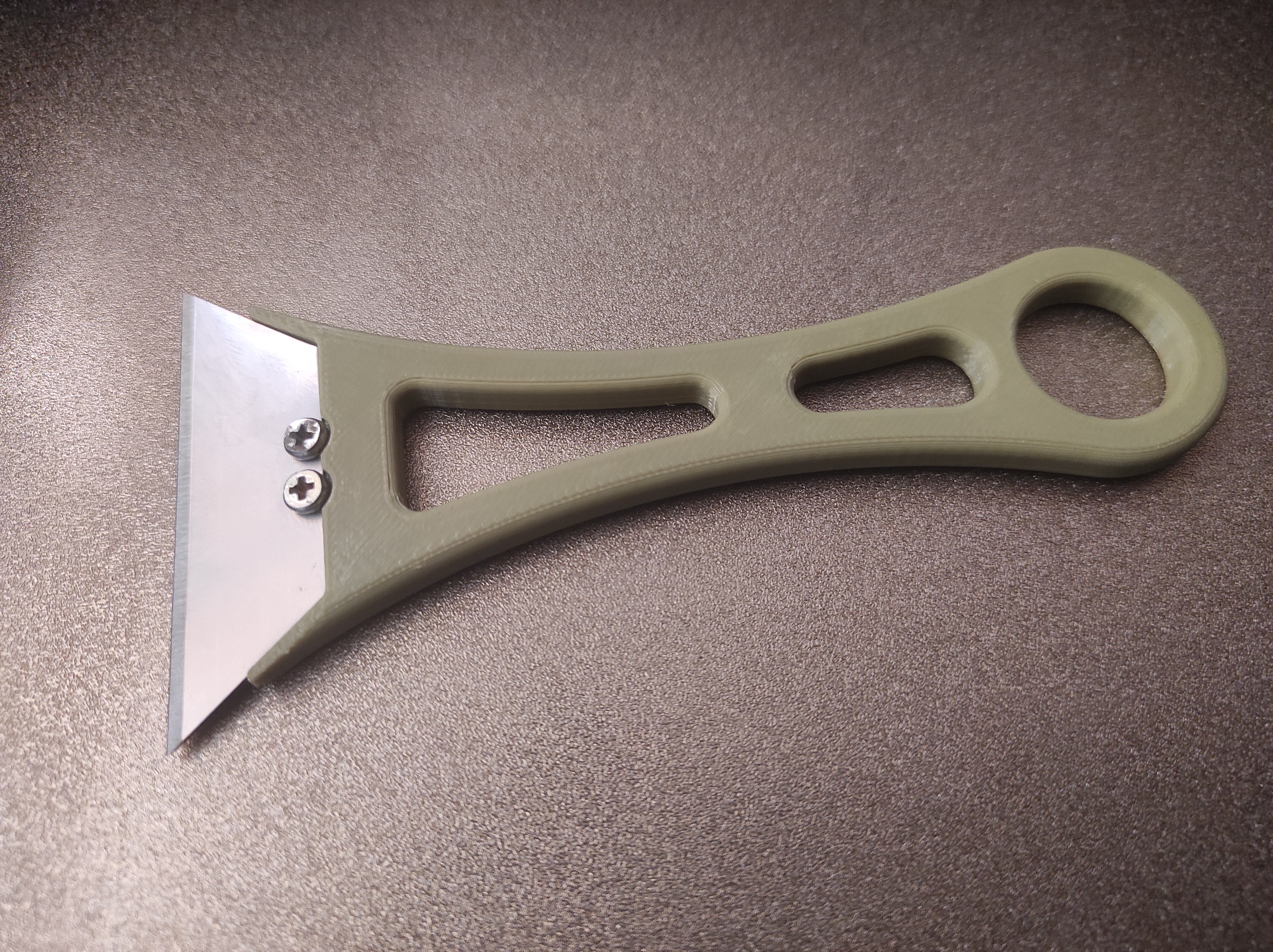 Scraper with replaceable blades