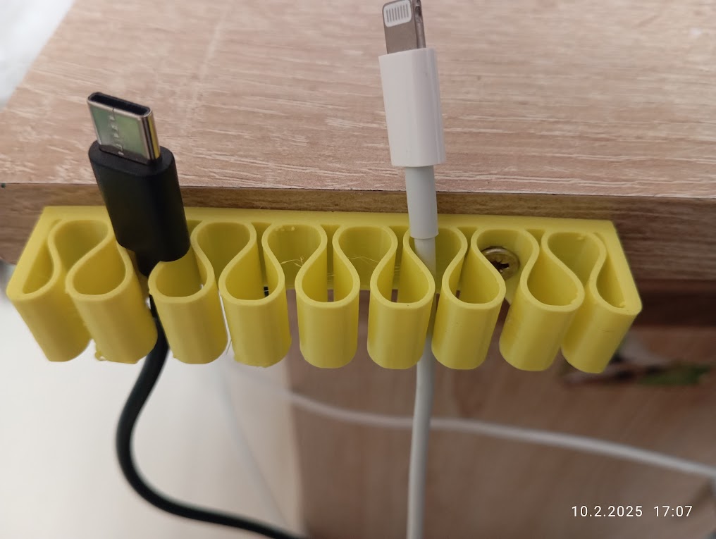 Universal Cable Holder, Držák kabelu