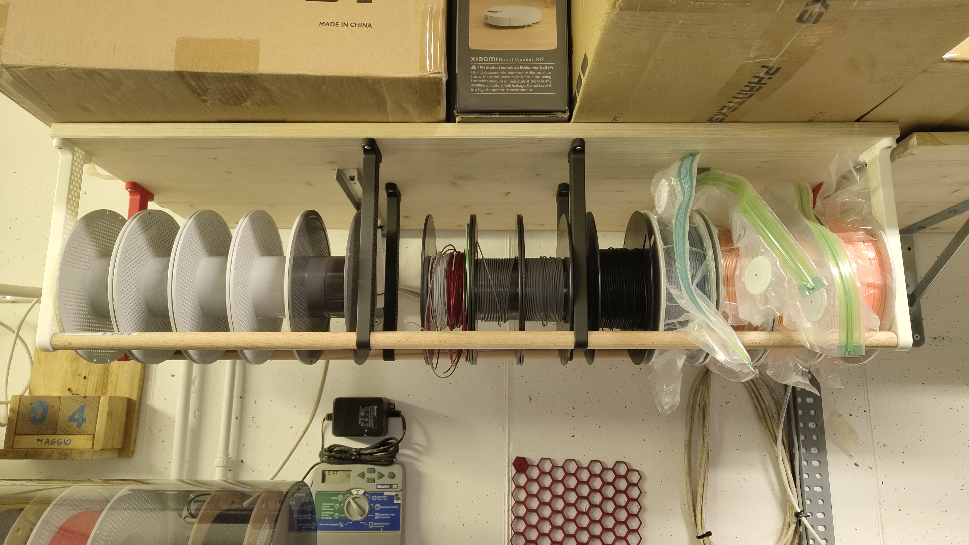 Under shelf / cealing mounted spool storage