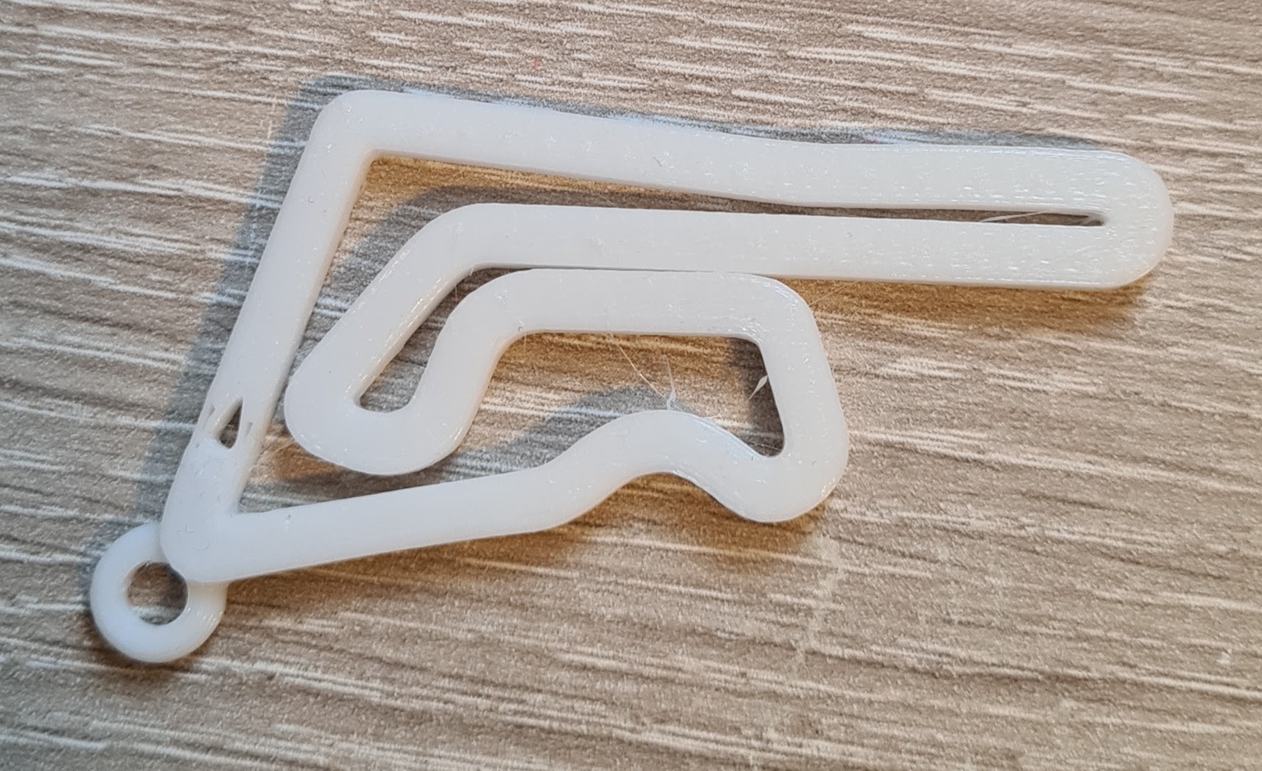 key ring in the shape of the Thailand - Chang International Circuit