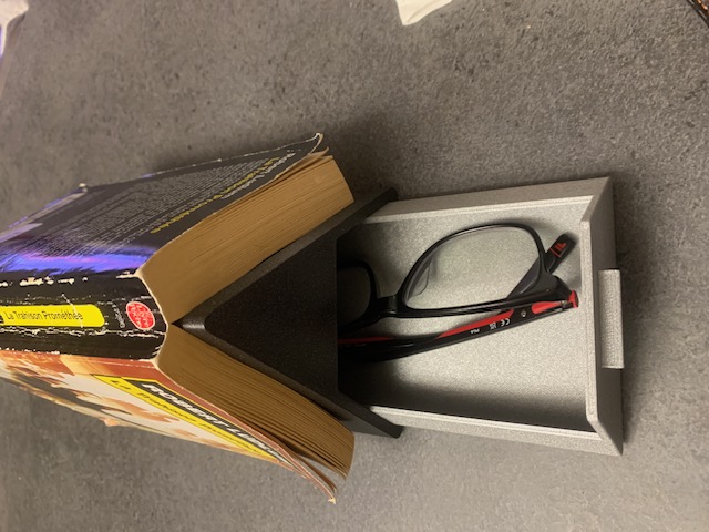 Support livre avec rangement lunettes ou telephone