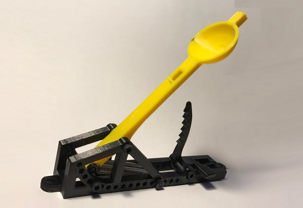 Spring loaded mini catapult