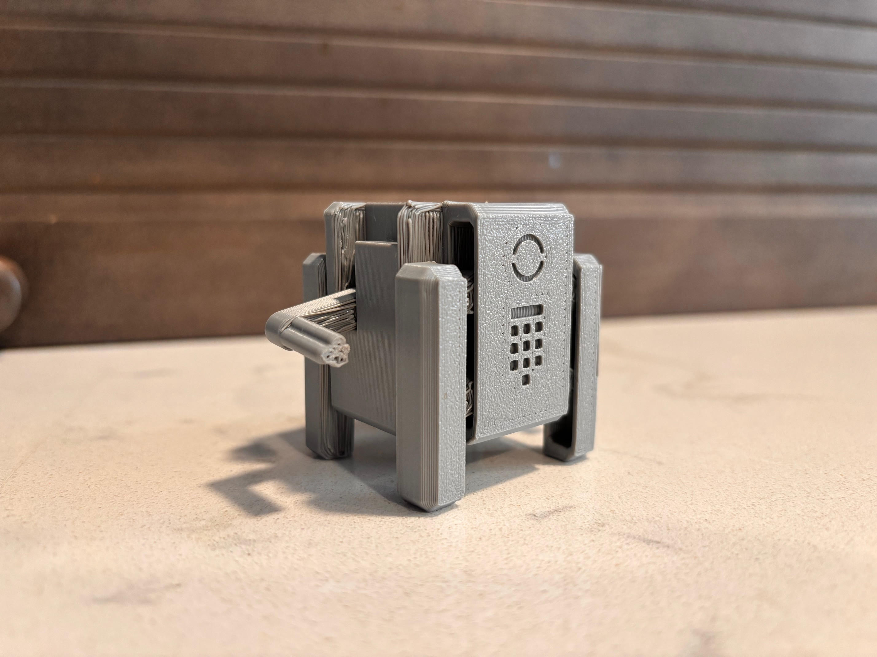 J-1.0: print in place transforming cube robot with cannons