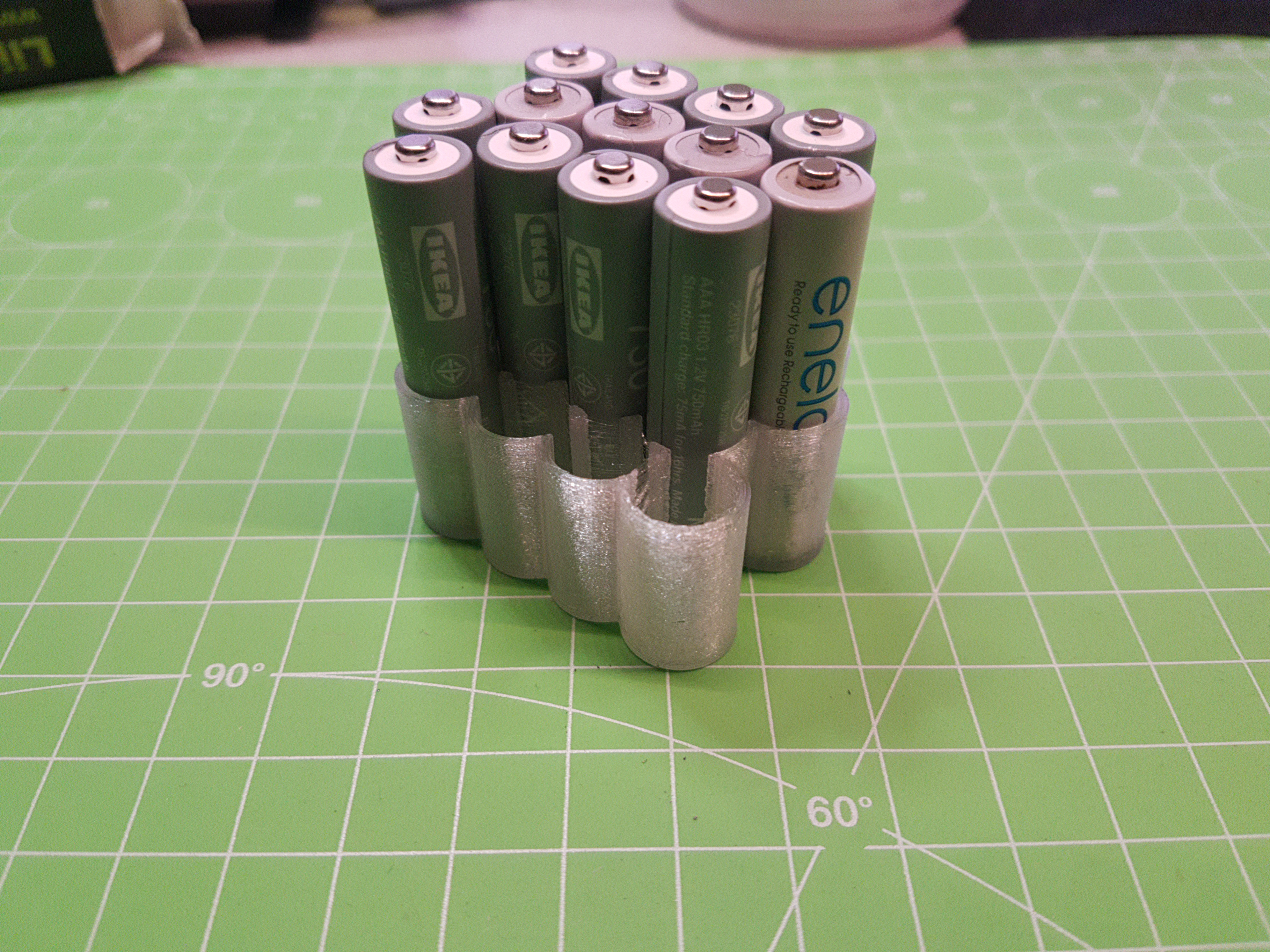 Parametric battery stand for all round cells (AA, AAA, 18650...)