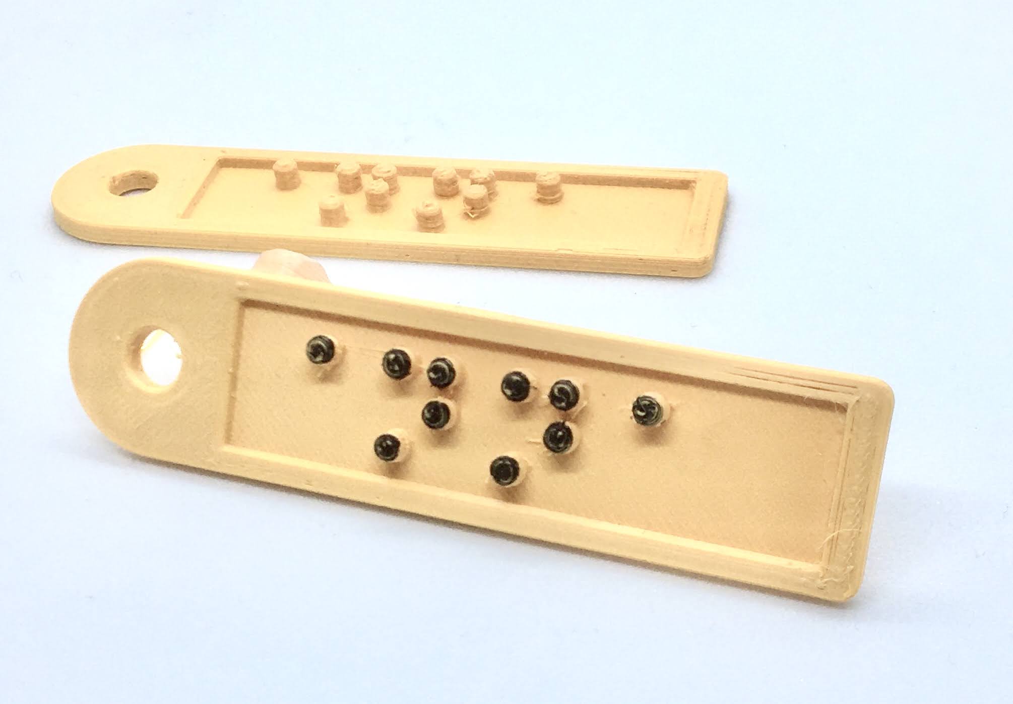 Keychain with the name Anna written in Braille
