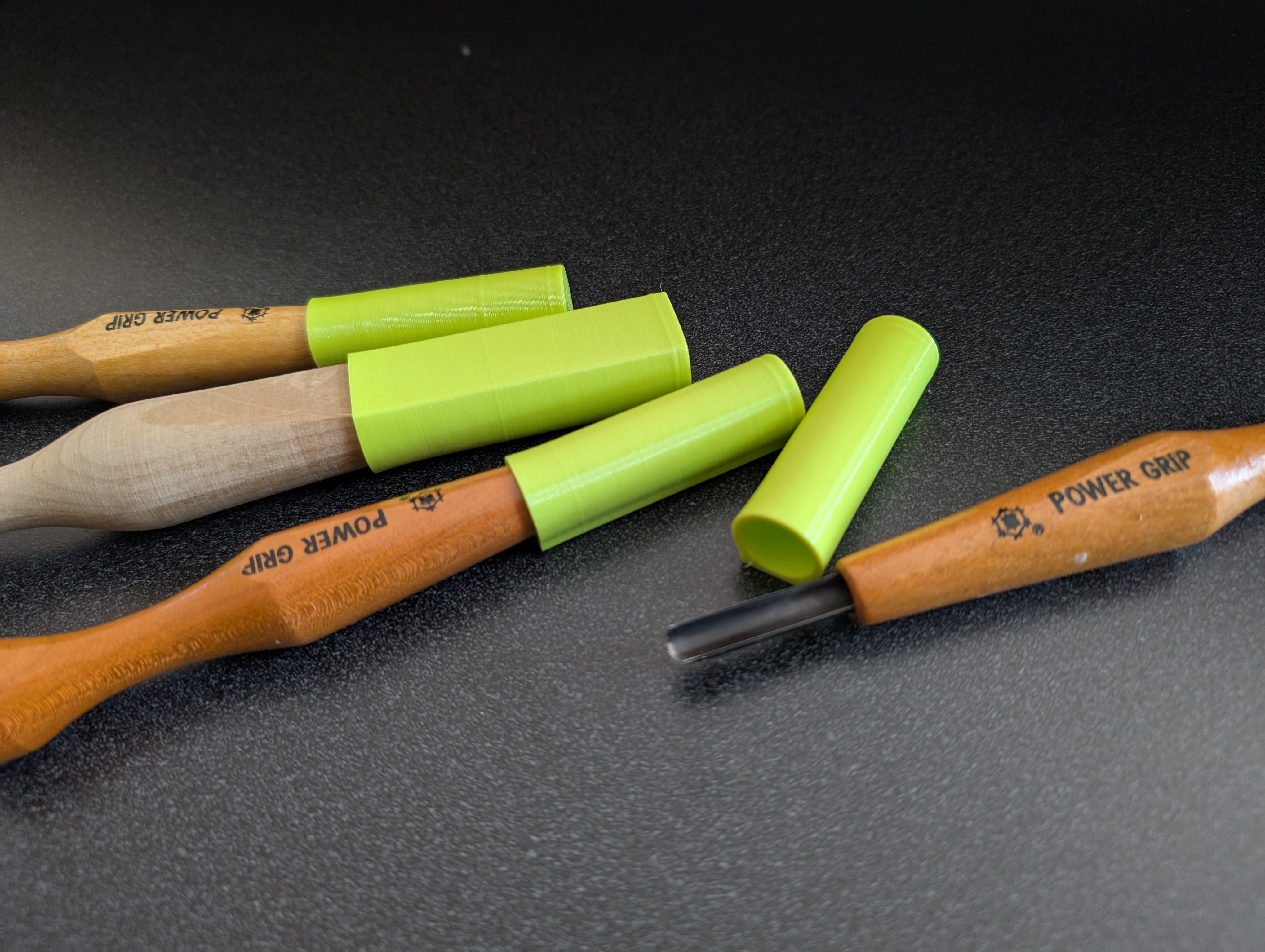 Safety caps for power grip carving tools