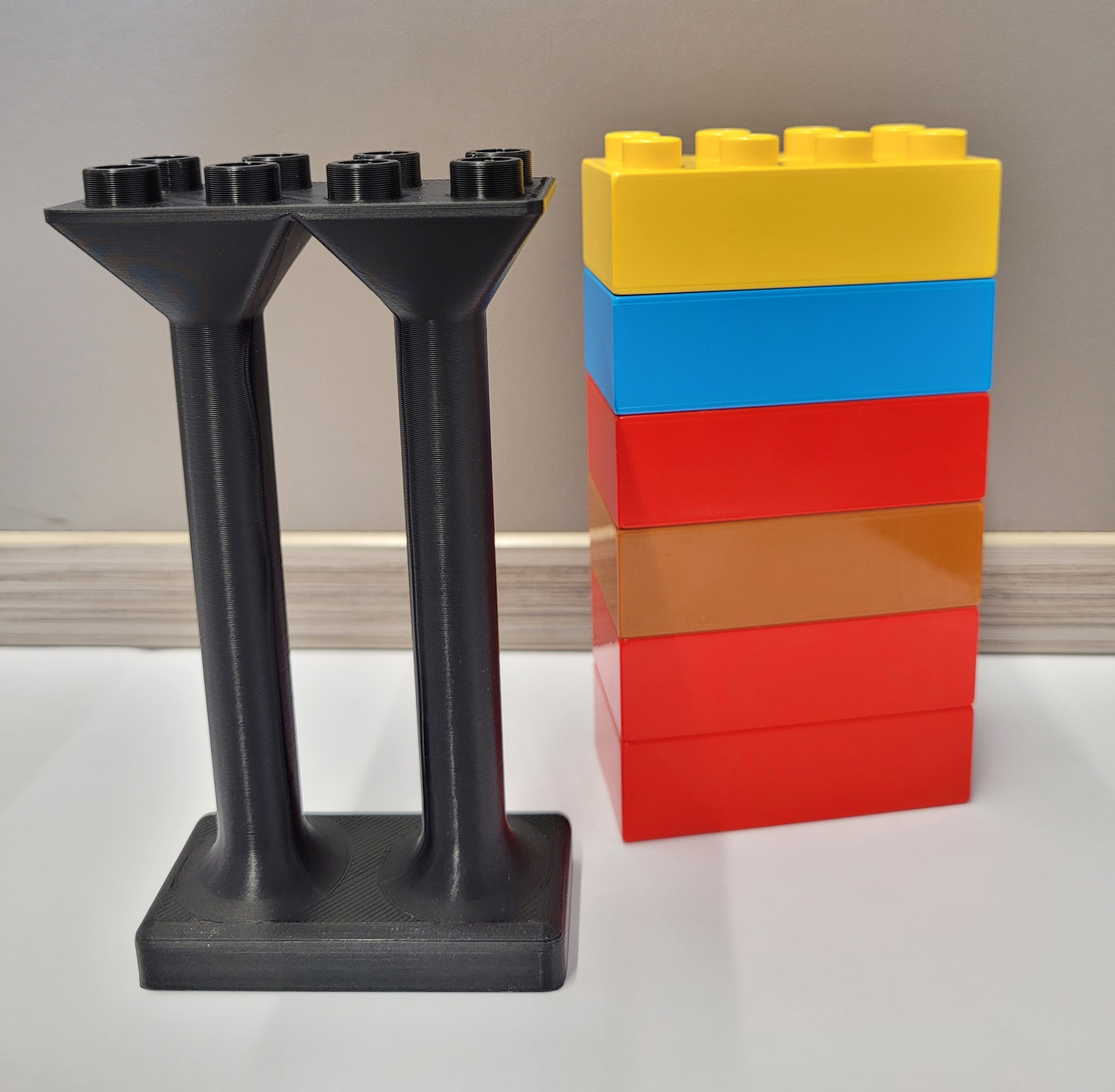 DUPLO compatible pillar 2x4 and 6 bricks high. Additional heights added...