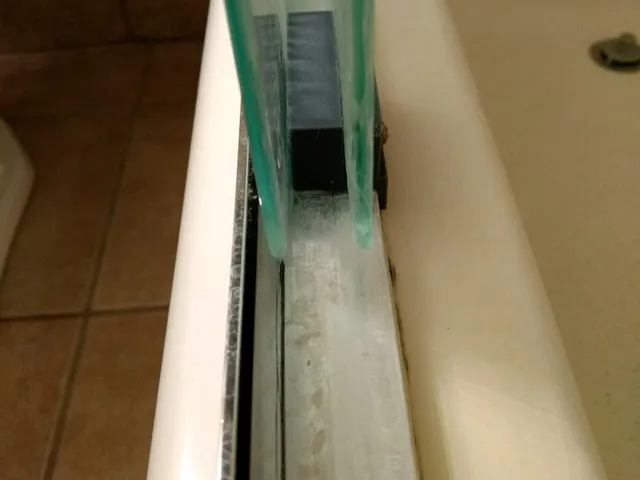 Glass shower door guide