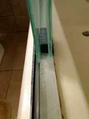 Glass shower door guide