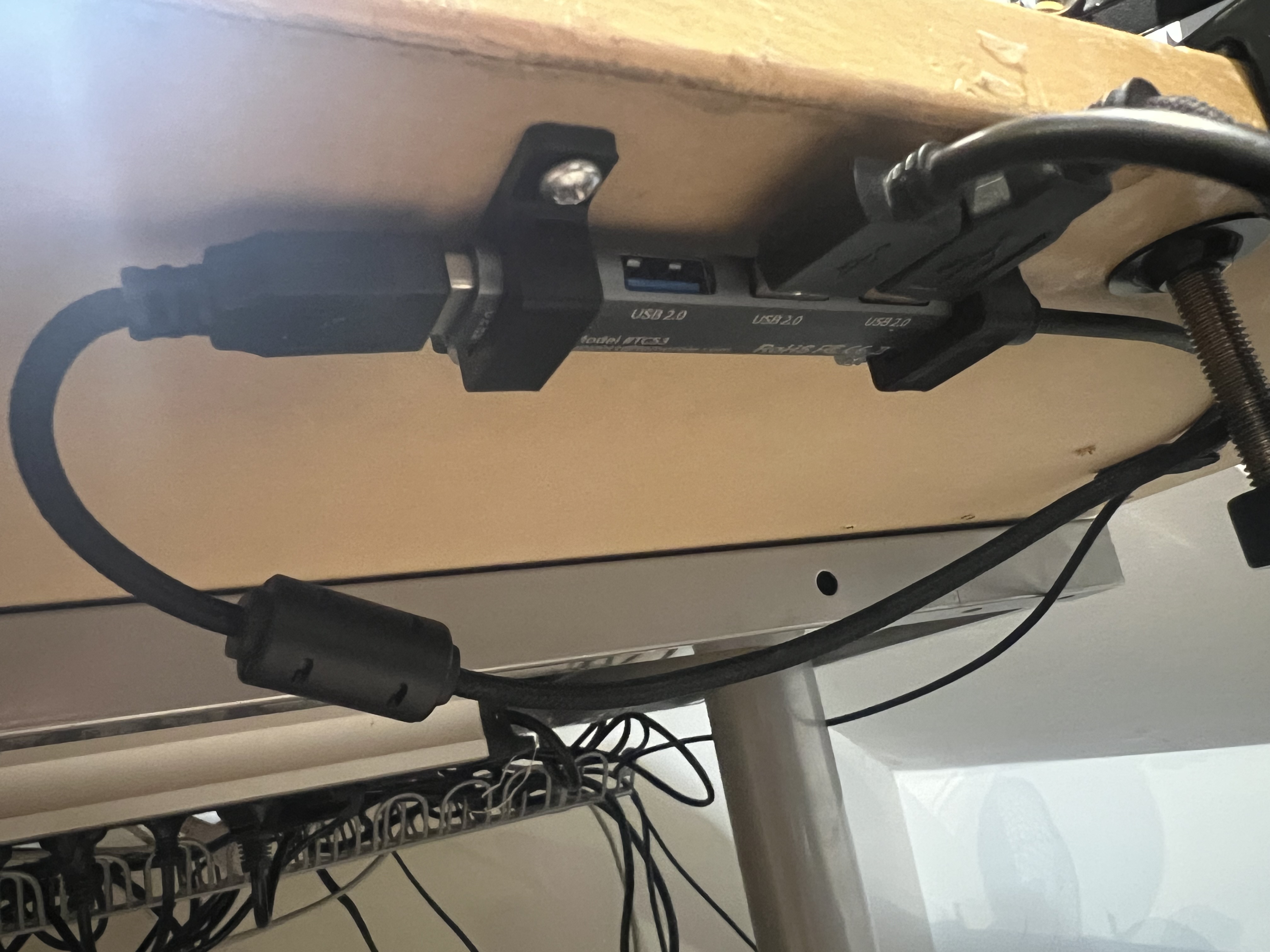 Small clip for mounting USB hub under desk
