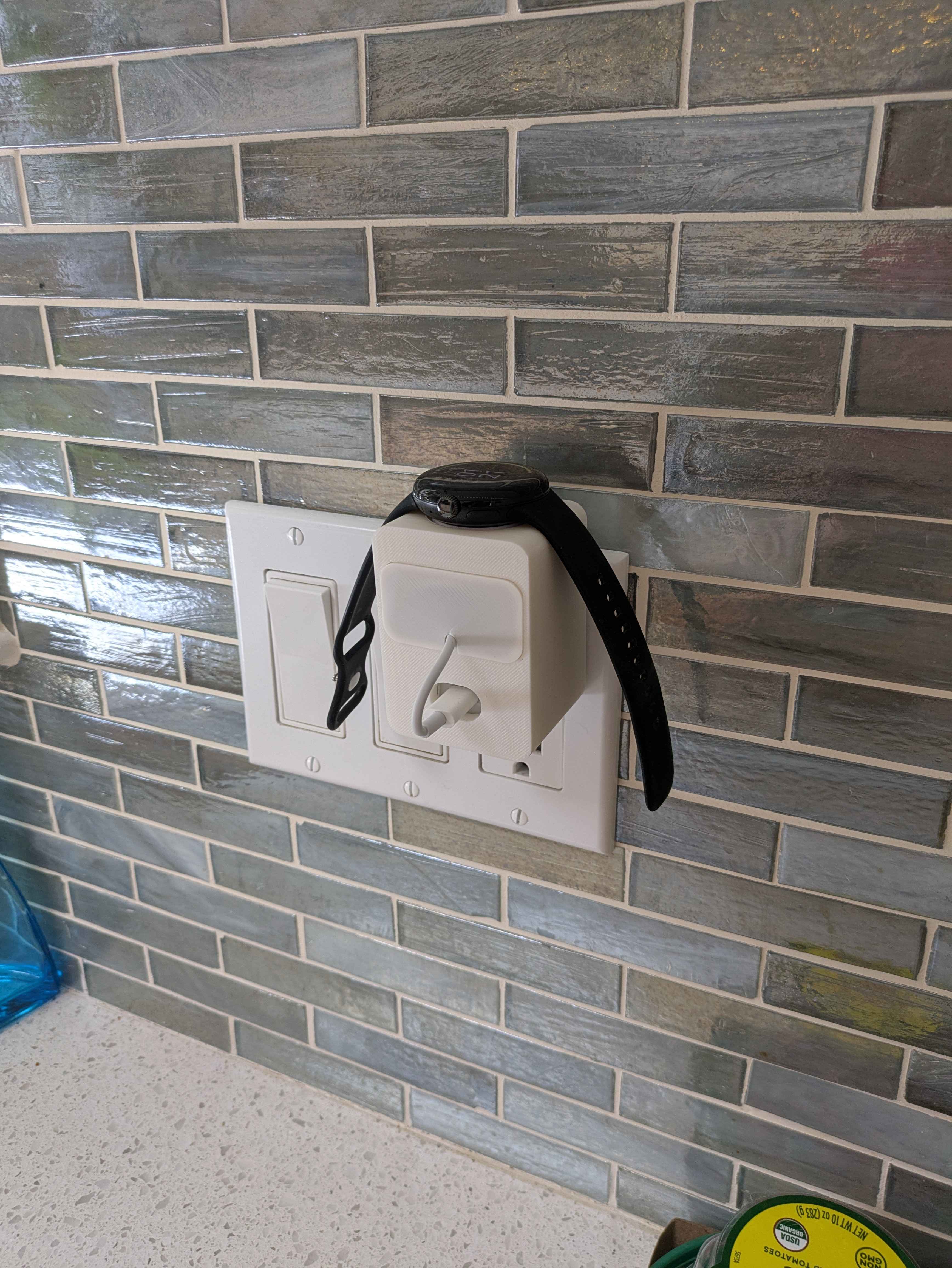 Sleek outlet-mounted Google Pixel Watch charger stand