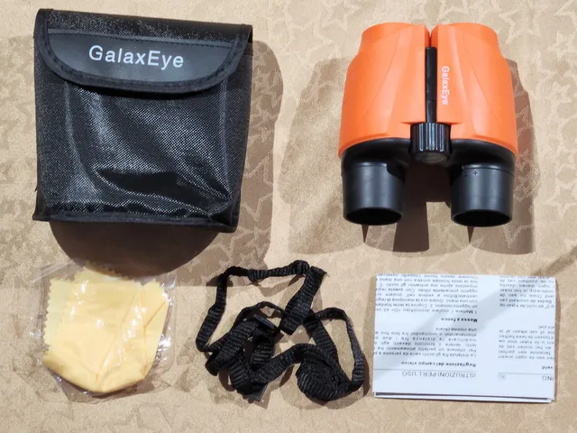 GalaxEye Compact Binoculars lens dust caps.