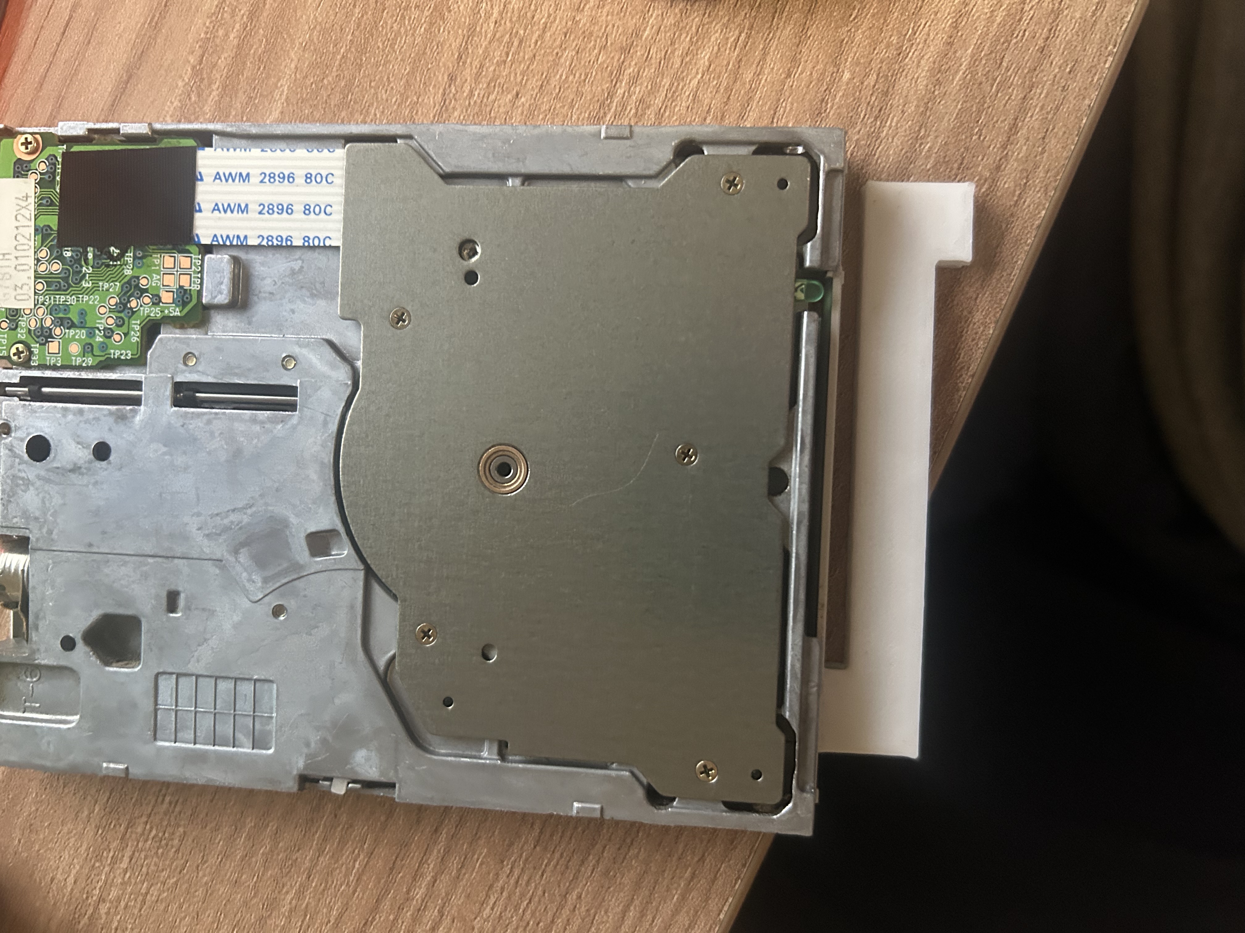 floppy disk eject button opposite direction