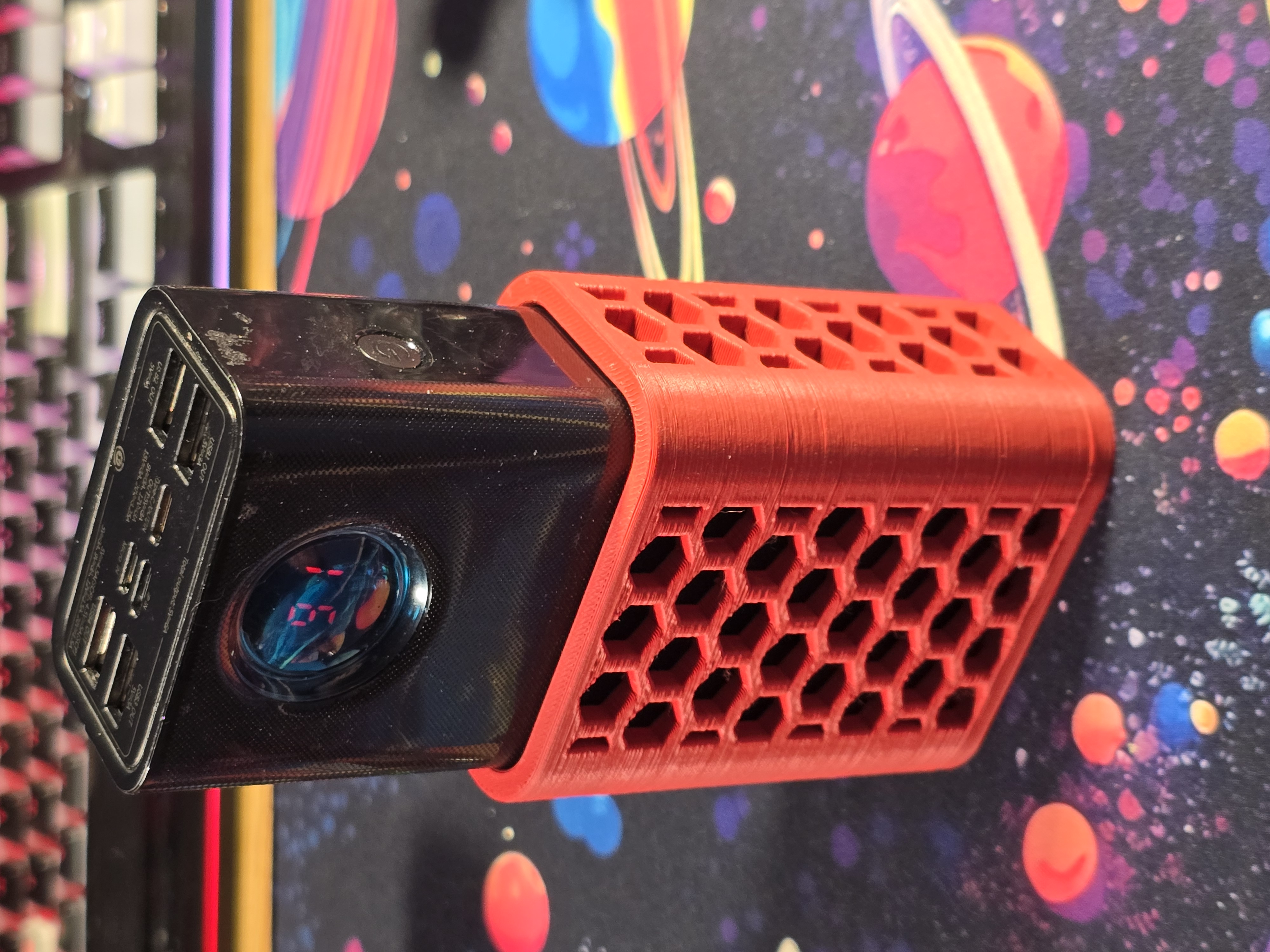 Battery holder for Baseus 65w 30k-mah battery bank, with hole for 1/4"-20 heat insert.