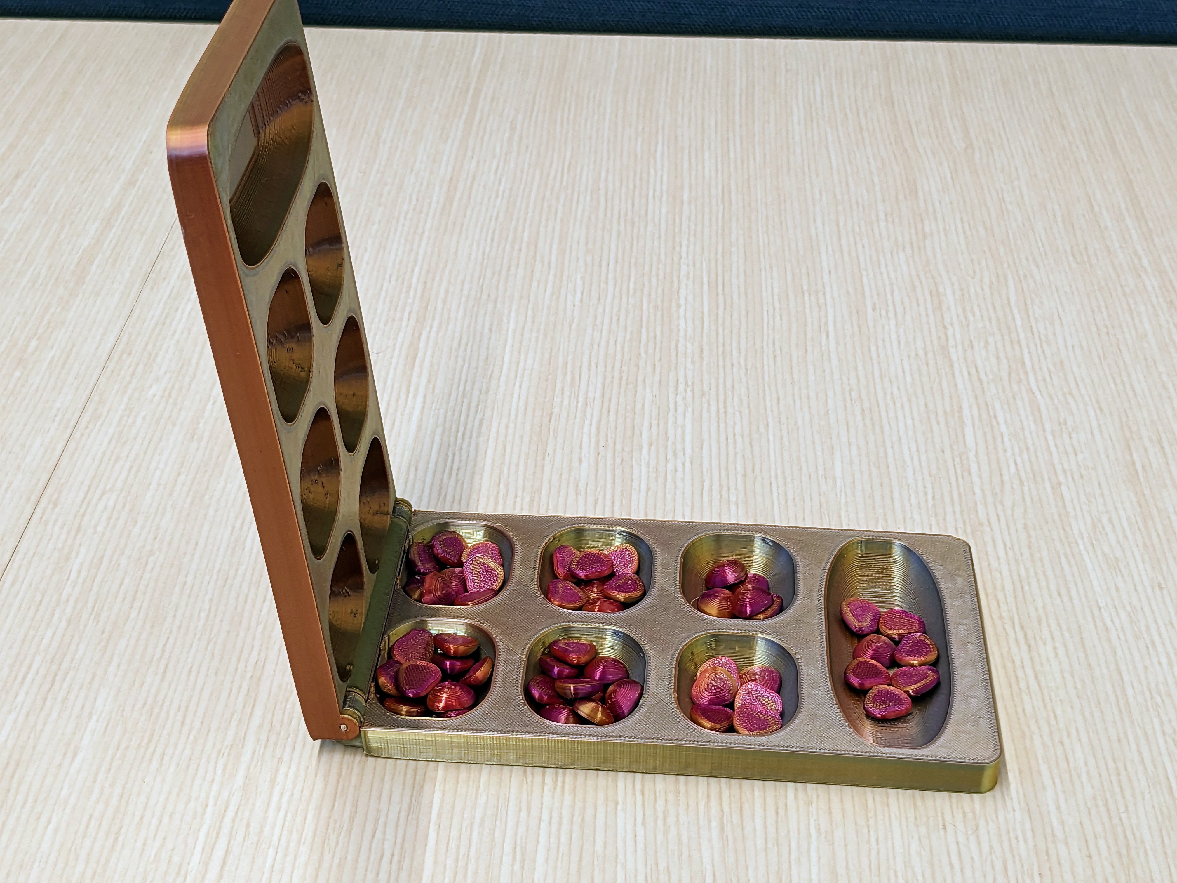 Hinged Mancala Game