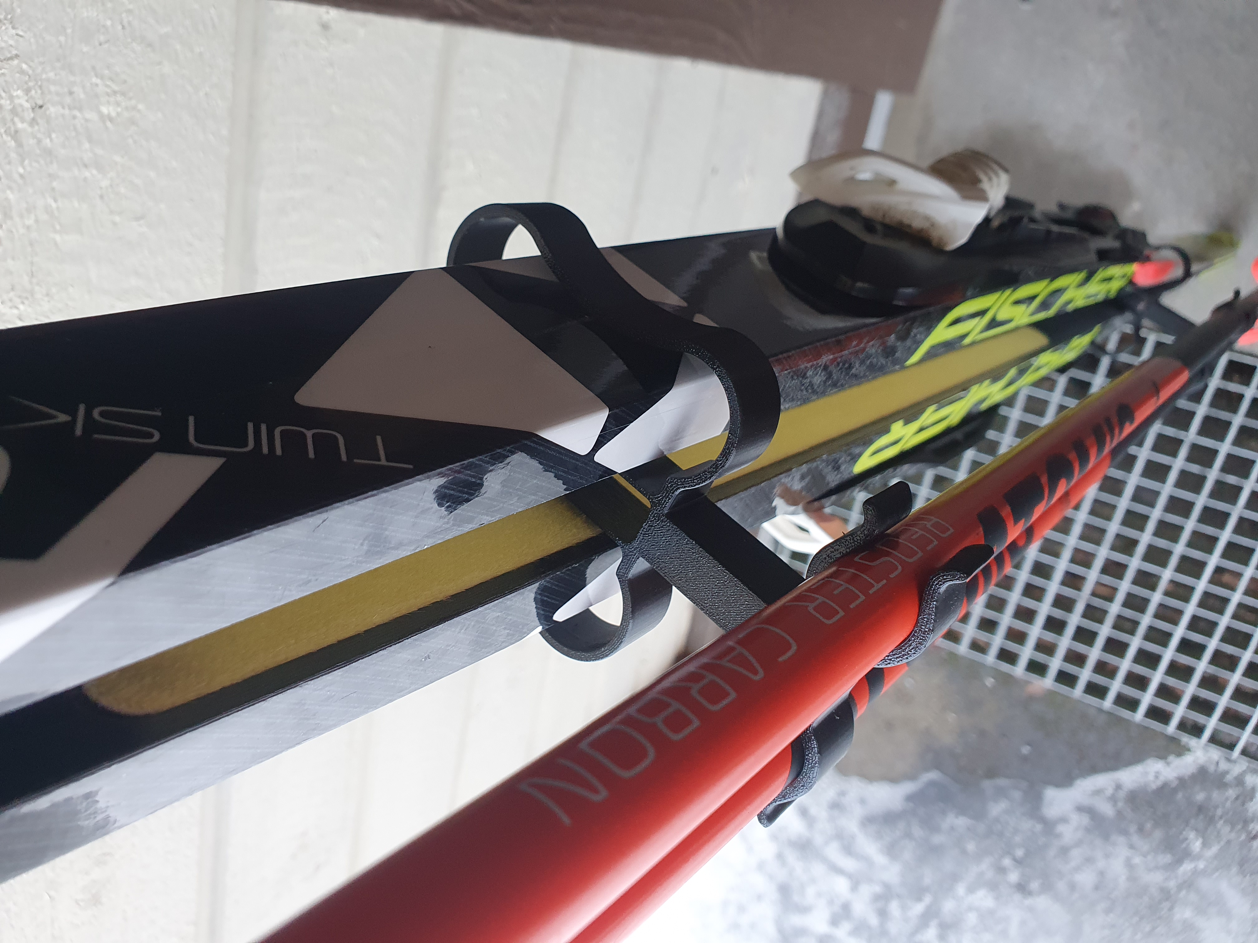 Ski and pole holder with filleted edges