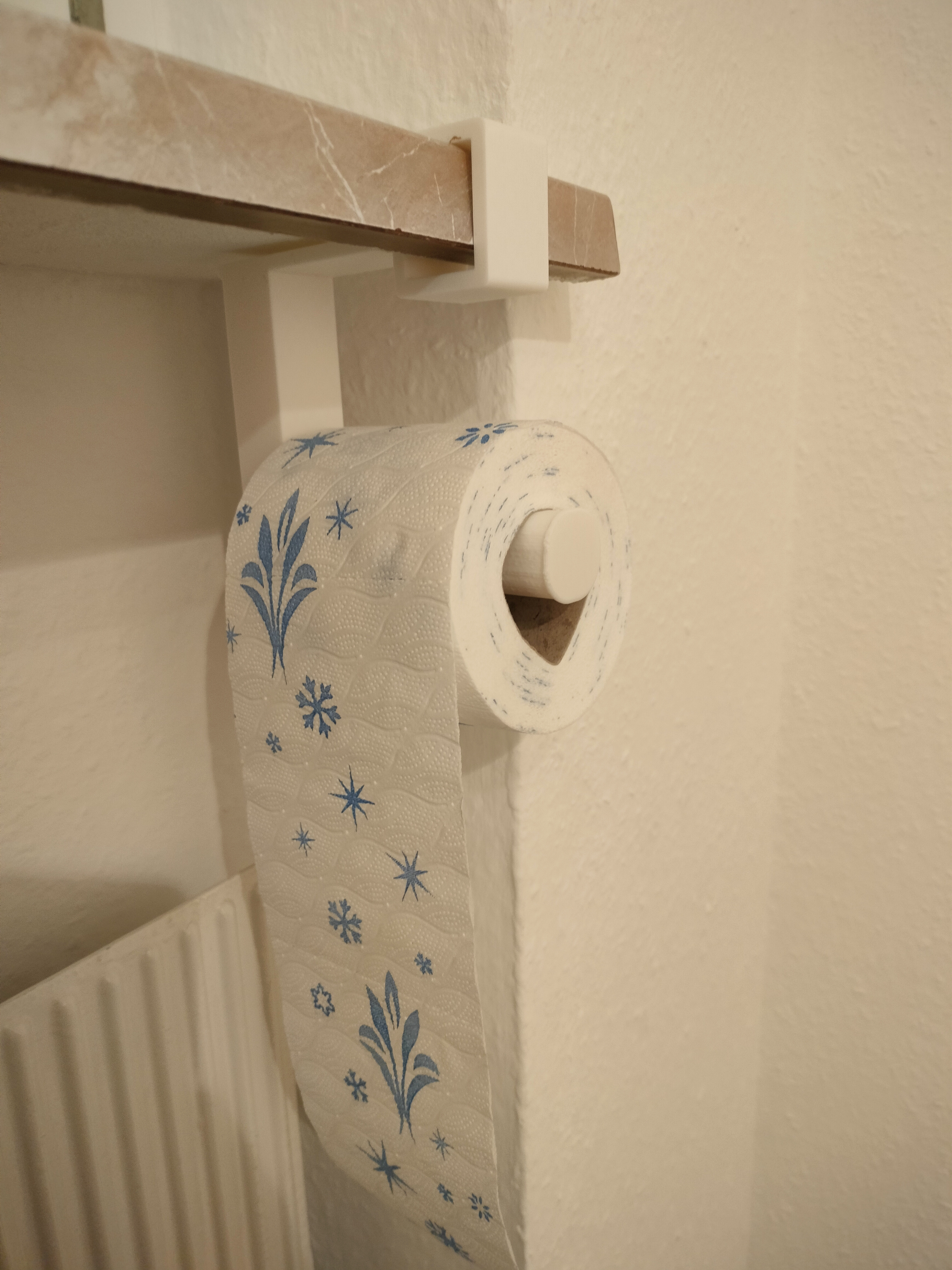 a toilet paper holder for the windowsill