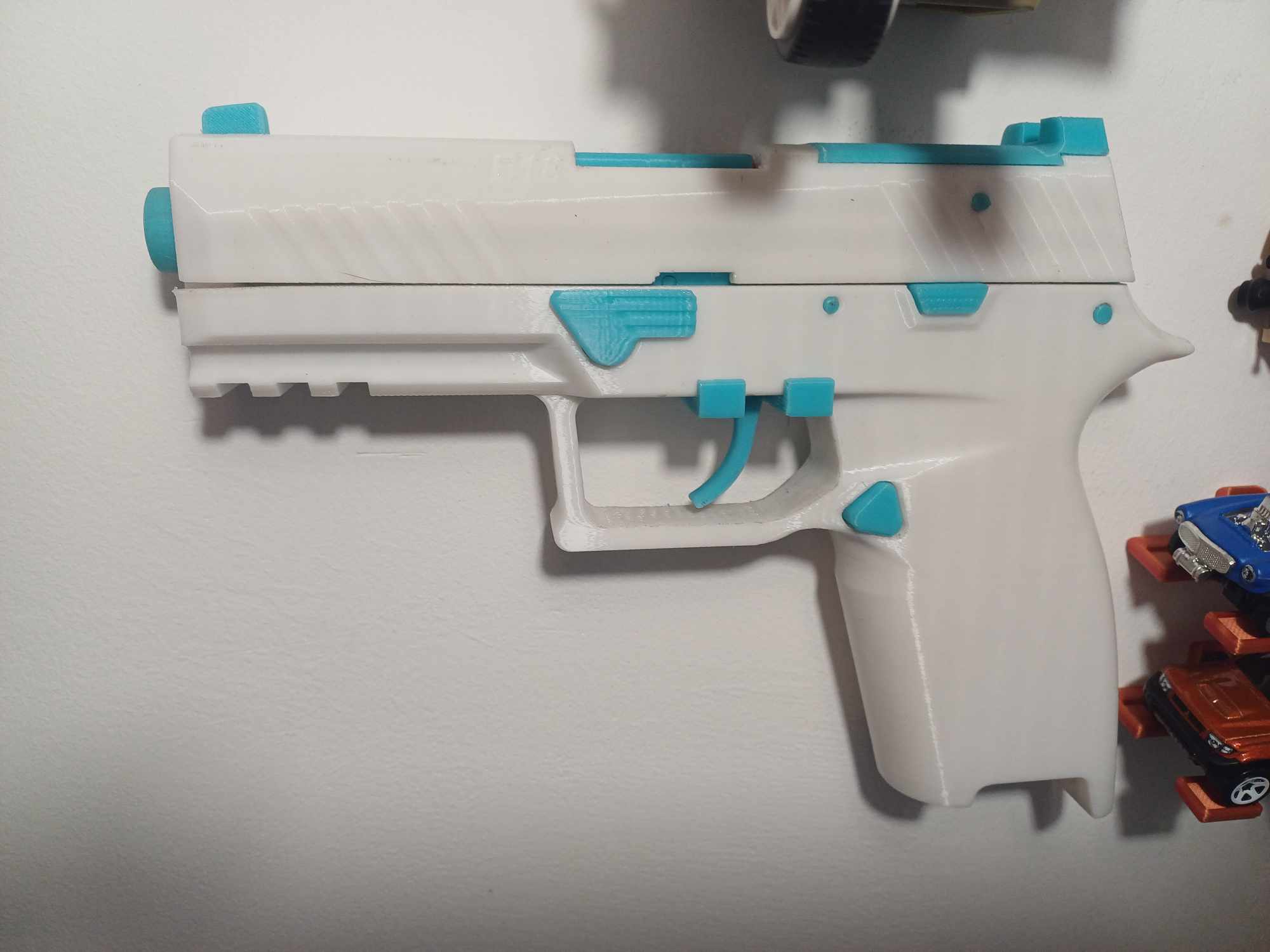 E18 toy pistol wall mount