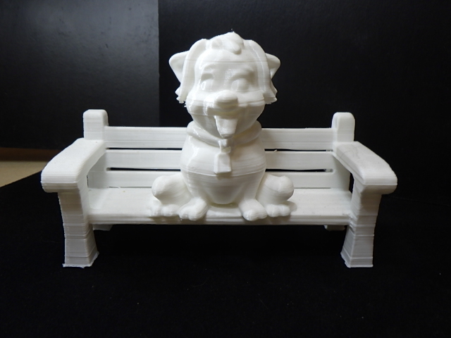 A dog sitting on a bench.