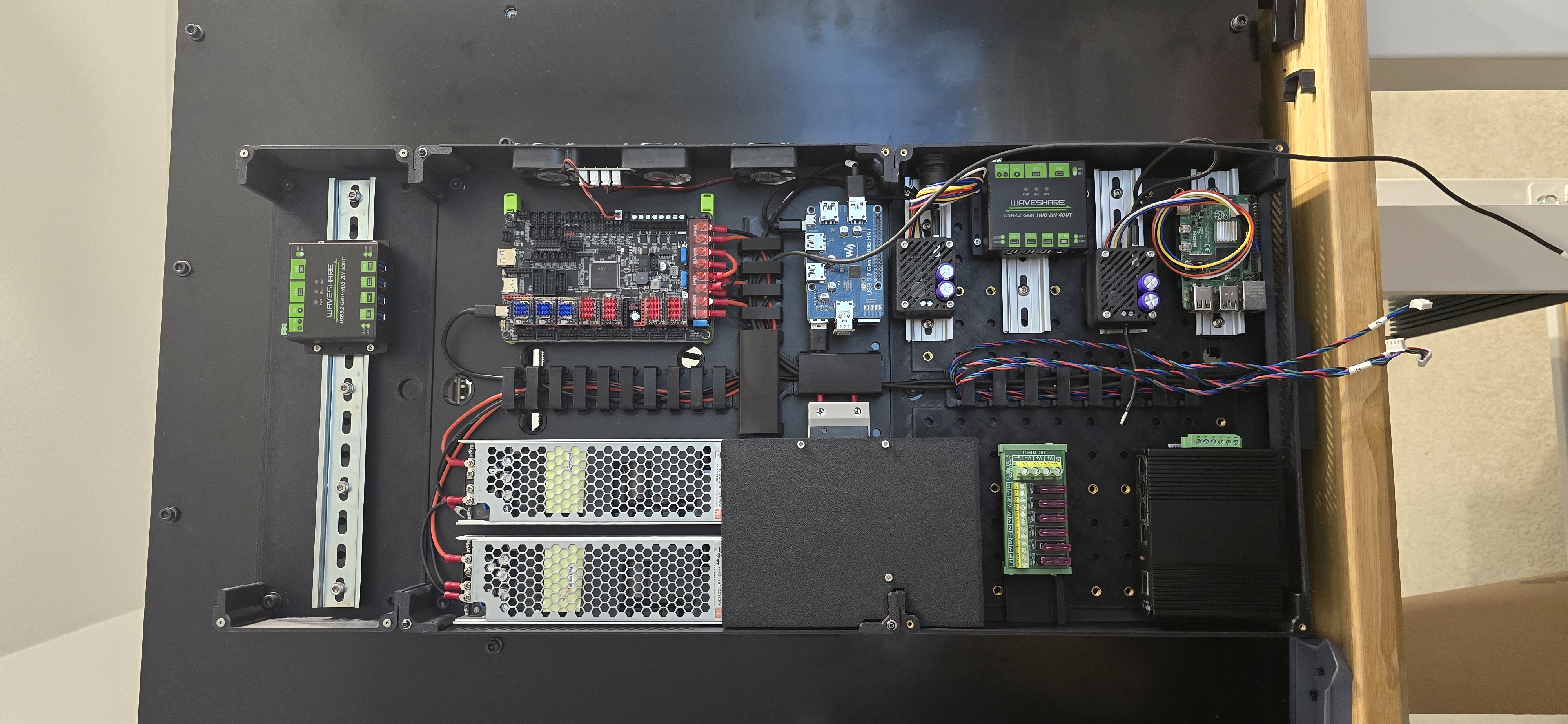 Bumbag electronics enclosure extensions with DIN rail mounts for RatRig VCORE 4.0